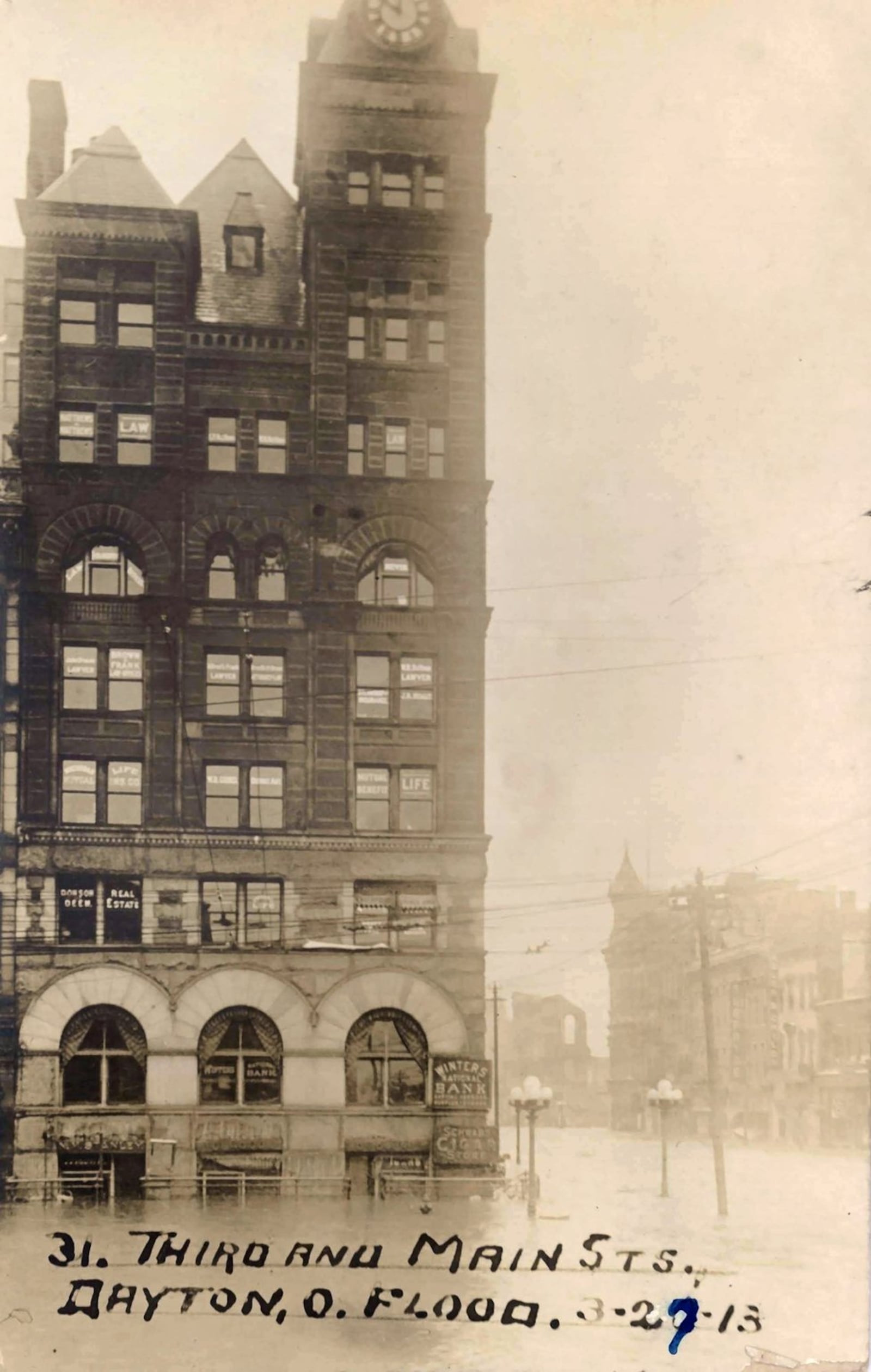 A view of Third and Main Street on a postcard taken in Dayton during the 1913 flood. DAYTON METRO LIBRARY