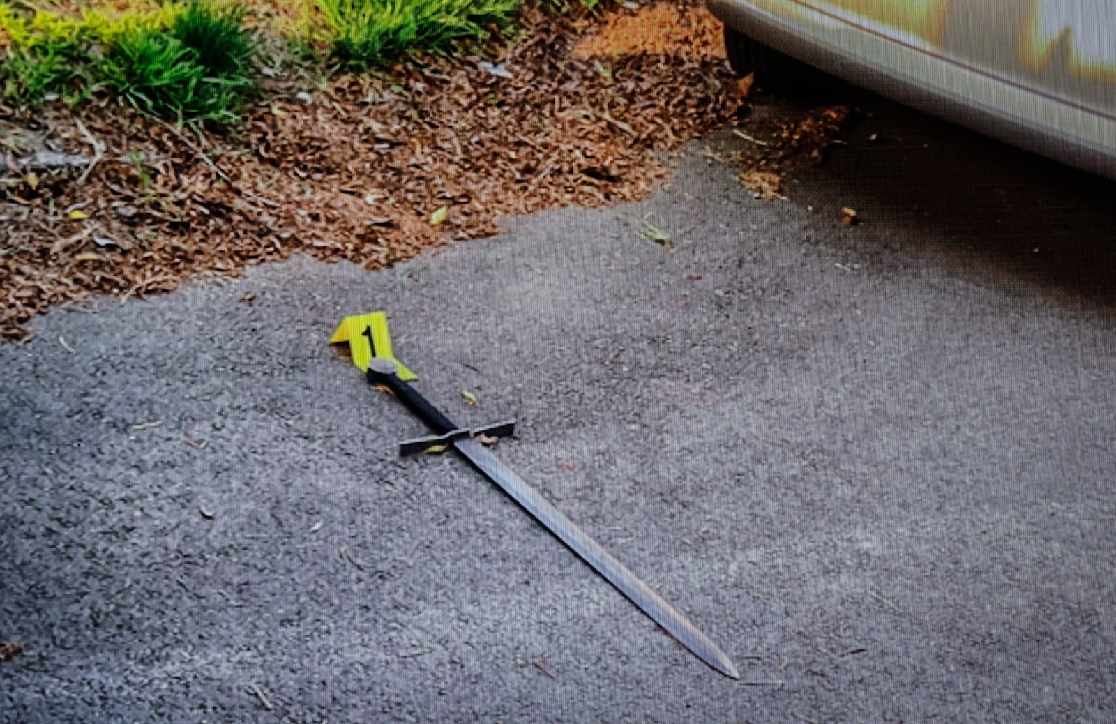 A Dayton man was running naked wielding this sword on Suman Avenue Wednesday afternoon, May 24, 2023, when he charged a Dayton police officer and two officers shot and wounded him. JIM NOELKER/STAFF