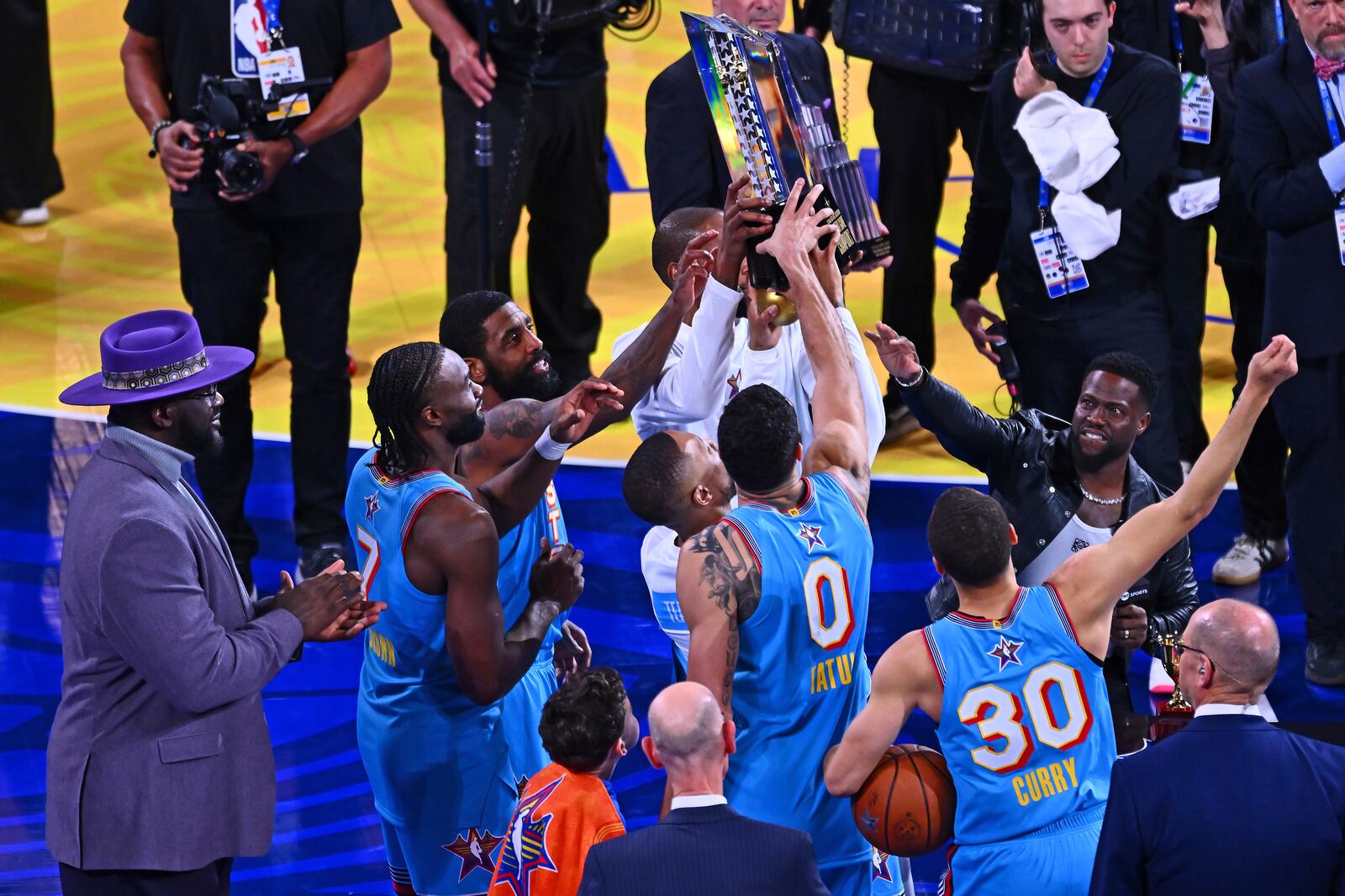 Shaq's OGs head coach Shaquille O'Neal claps as his team raises the trophy after winning the NBA All-Star basketball game in San Francisco, on Sunday, Feb. 16, 2025. (Jose Carlos Fajardo/Bay Area News Group via AP)