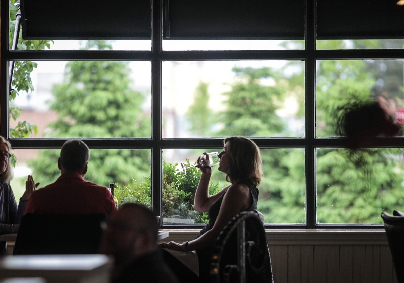 Coco's Bistro on Warren Street in Dayton open for indoor dinning Thursday night. Coco's owner. Karen Gagnet said that customers seem to be grateful and appreciative of the coronavirus seating and servers wearing protective gear.

Staff photo: Jim Noelker