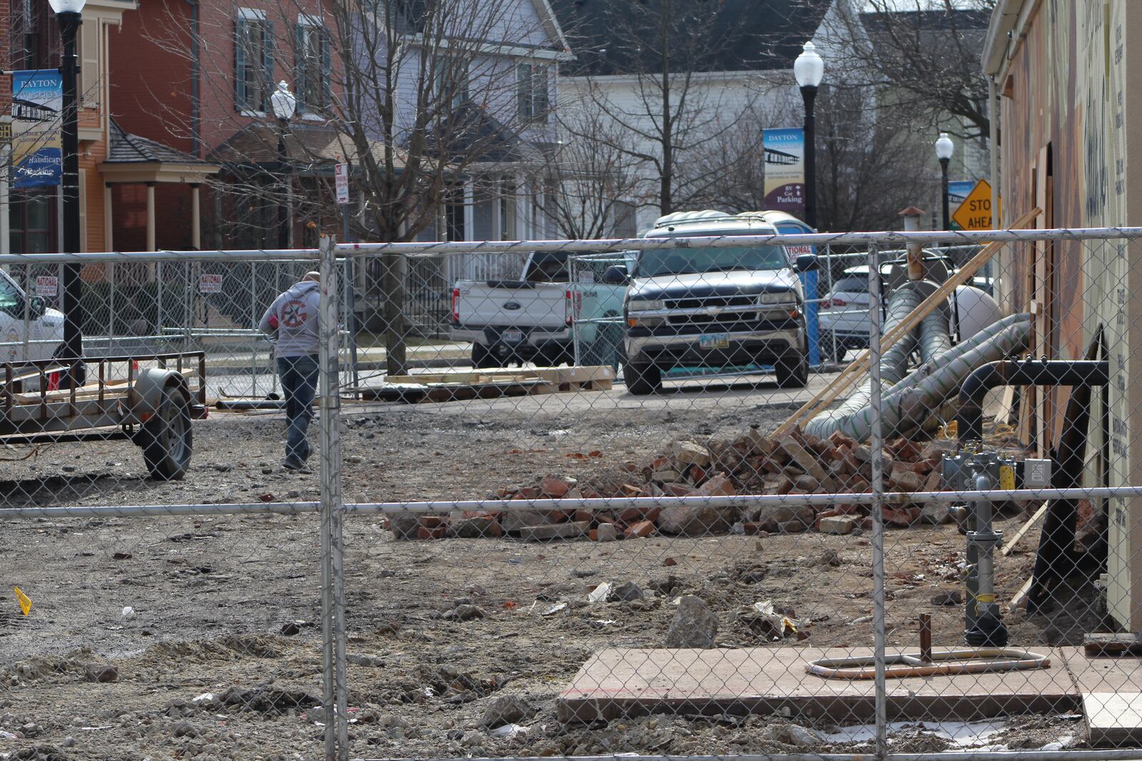 Work continues outside the W. Social Tap & Table food hall project in the Wright Dunbar business district. CORNELIUS FROLIK / STAFF