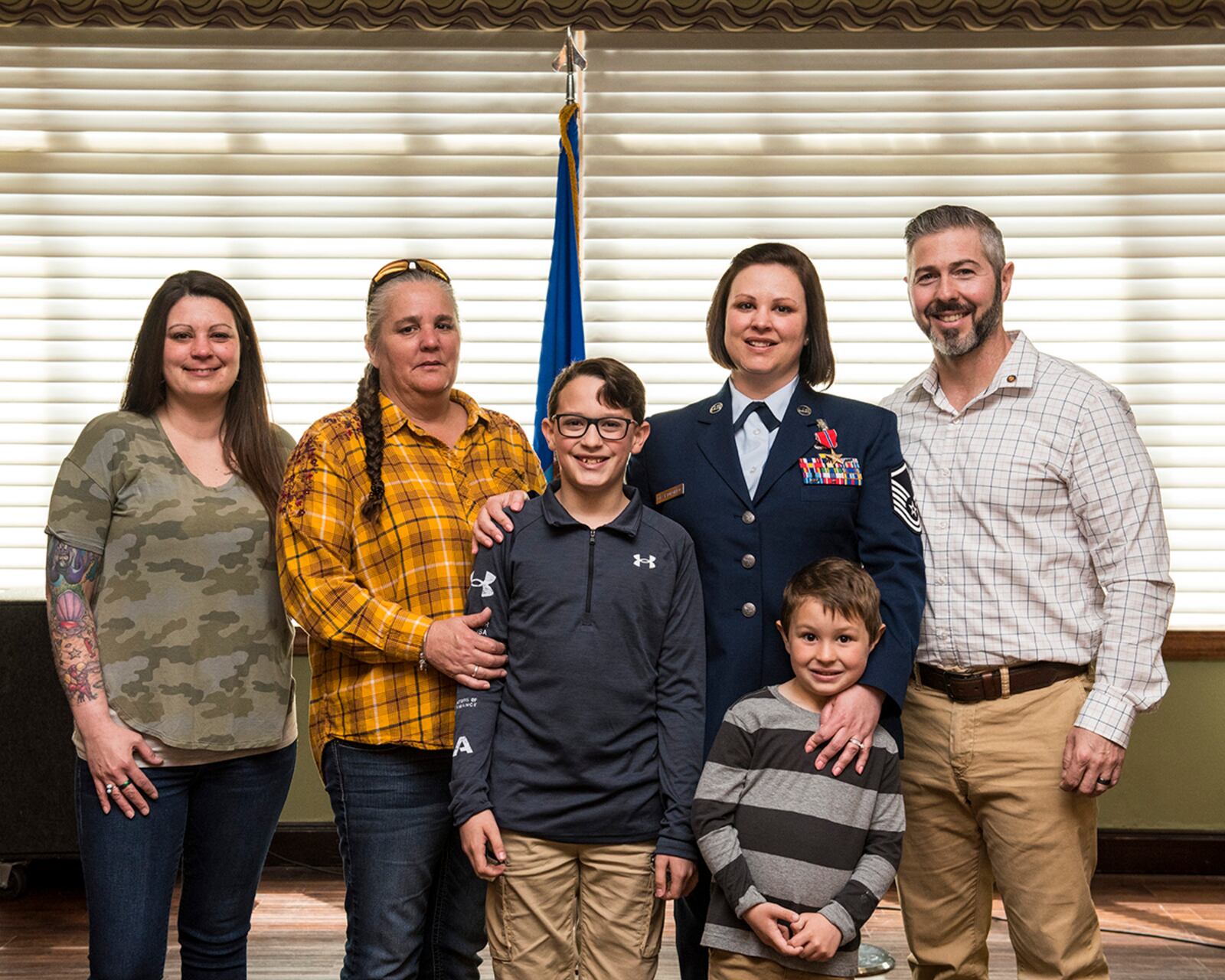 Master Sgt. Wendi DiBartolomeo stands with her family following a ceremony where she was awarded the Bronze Star Medal April 15 at Wright-Patterson Air Force Base. U.S. AIR FORCE PHOTO/JAIMA FOGG