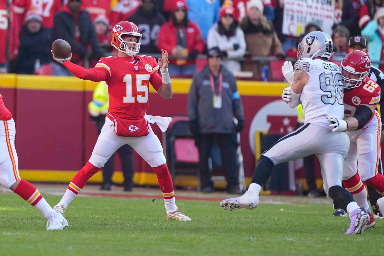 Kansas City Chiefs quarterback Patrick Mahomes (15) throws against the Las Vegas Raiders during the first half of an NFL football game in Kansas City, Mo., Friday, Nov. 29, 2024. (AP Photo/Charlie Riedel)