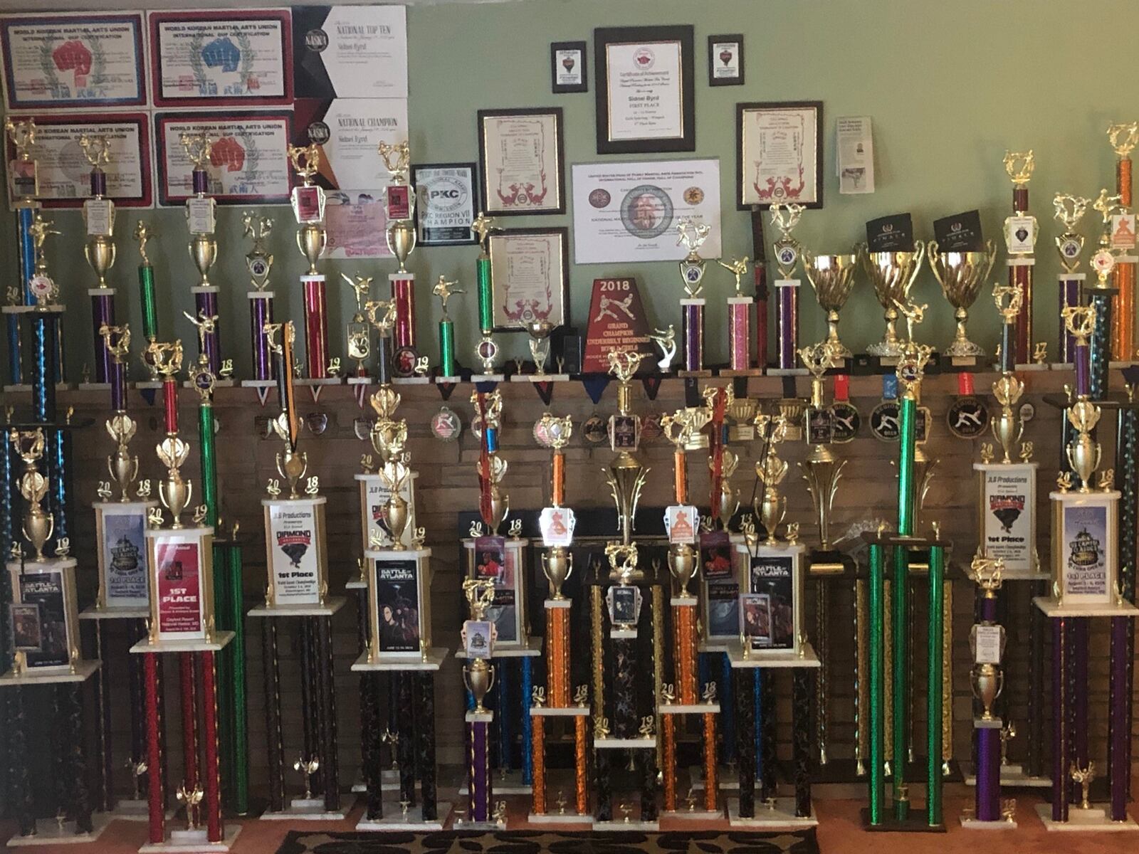 Part of the trophy collection of Sidnei Byrd’s karate exploits on display in her home.  CONTRIBUTED