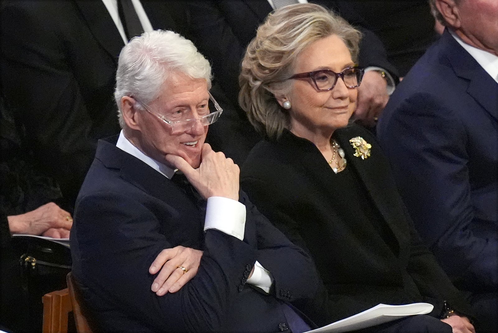 Former President Bill Clinton and former Secretary of State Hillary Clinton listen during the state funeral for former President Jimmy Carter at Washington National Cathedral in Washington, Thursday, Jan. 9, 2025. (AP Photo/Jacquelyn Martin)