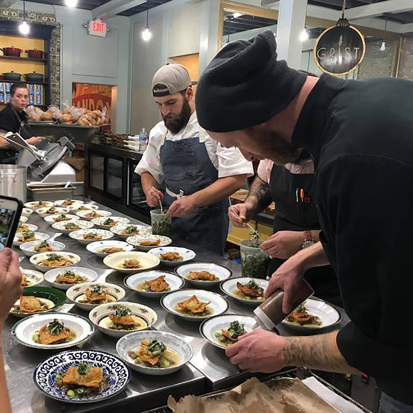 Andy Bagherian and his long time friend and cofounder of Jollity, Zackary Weiner work together often during the many Jollity pop-up events. Here they are plating a main course prior to serving to customers. CONTRIBUTED