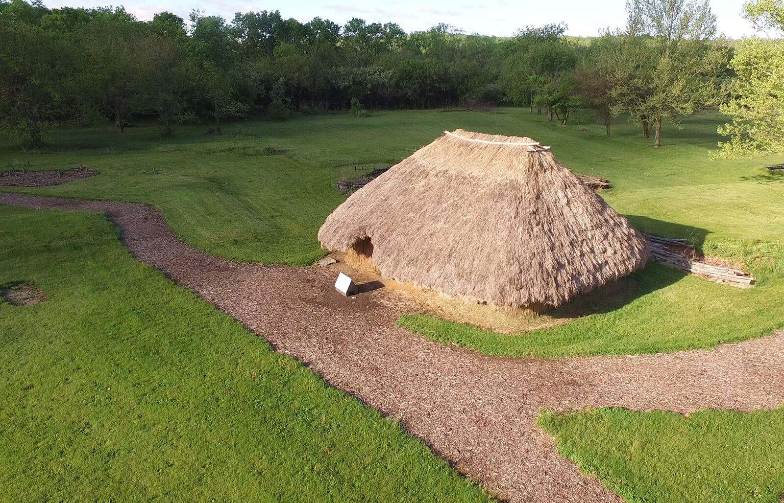 Recreated lath and mud daub structures with grass thatched roofs stand in the exact same location as the originals.  The SunWatch Indian Village/Archaeological Park is nestled in mature trees along the Great Miami River south of Dayton.    TY GREENLEES / STAFF