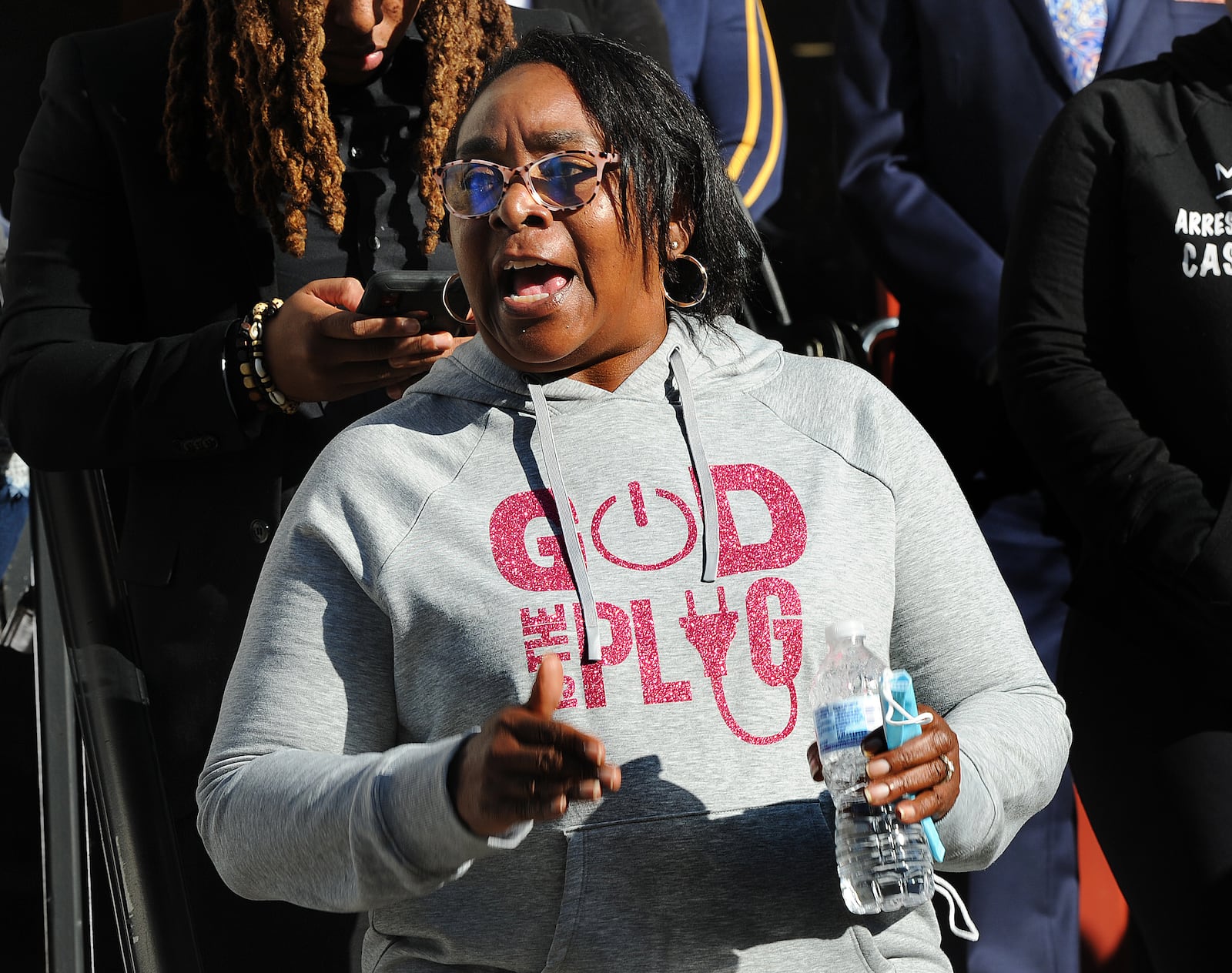 Caroline Smith, the mother of  Clifford Owensby, spoke to protesters outside Dayton City Hall on Wednesday, Oct. 13, 2021 demanding justice for her son. MARSHALL GORBY\STAFF