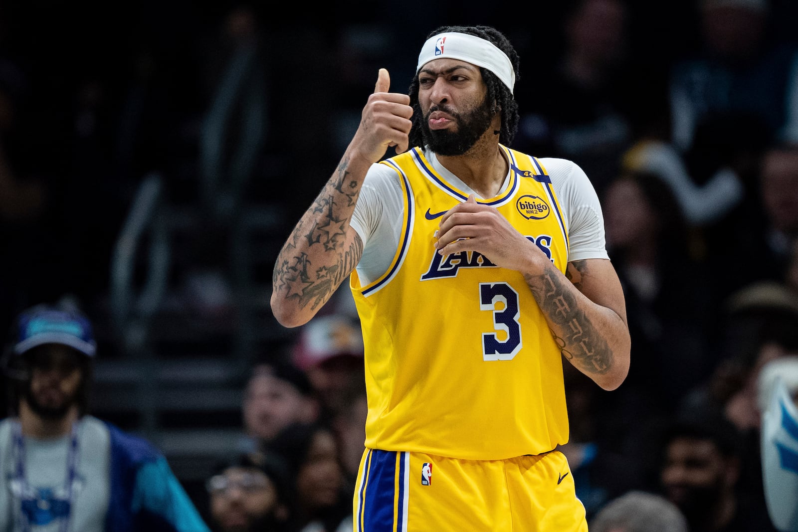 Los Angeles Lakers forward Anthony Davis reacts during the second half of an NBA basketball game against the Charlotte Hornets, Monday, Jan. 27, 2025, in Charlotte, N.C. (AP Photo/Jacob Kupferman)