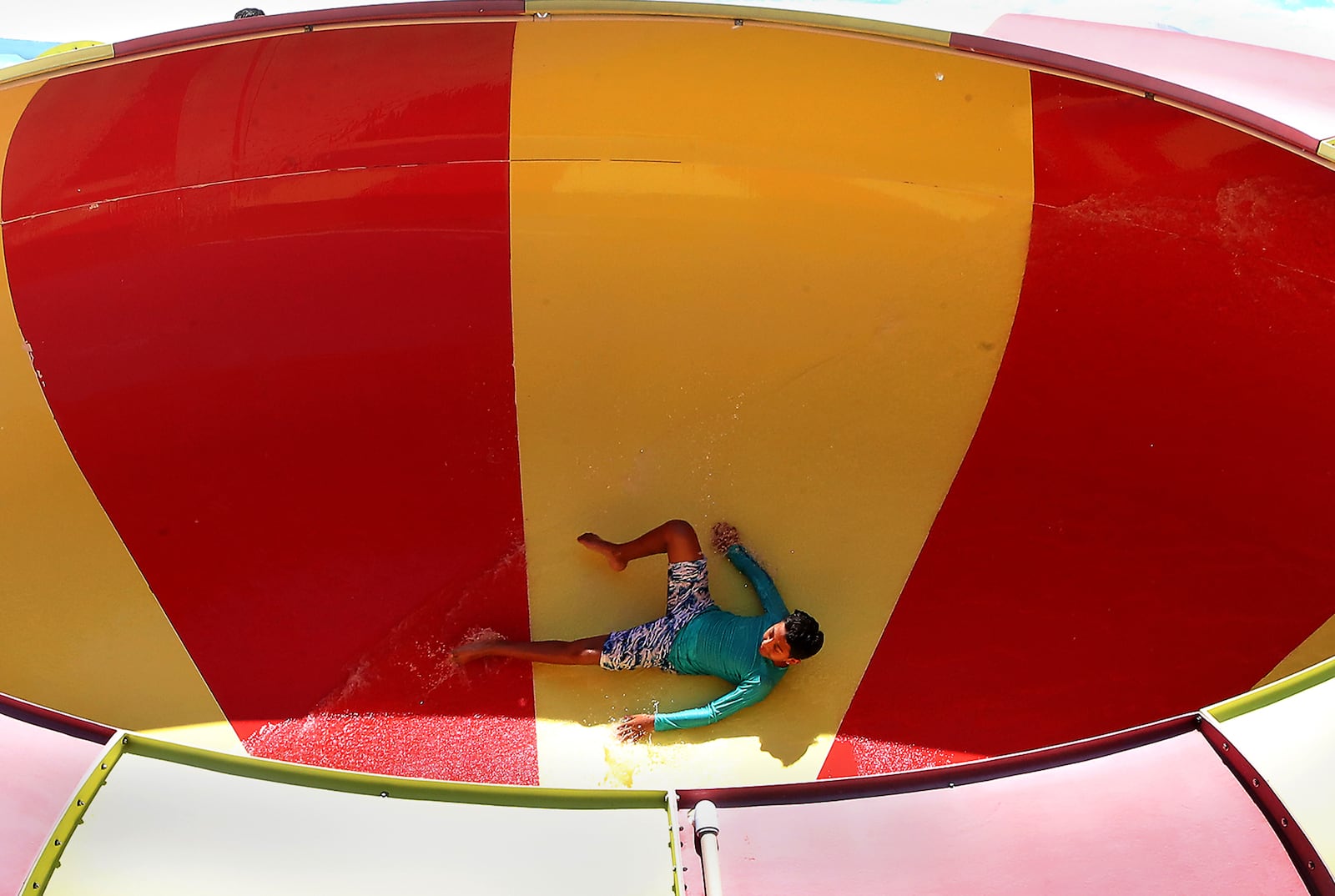 A swimmer spins around the Water Vortex, Ohio's first bowl slide, at Splash Zone in Springfield Tuesday, May 31, 2022. BILL LACKEY/STAFF