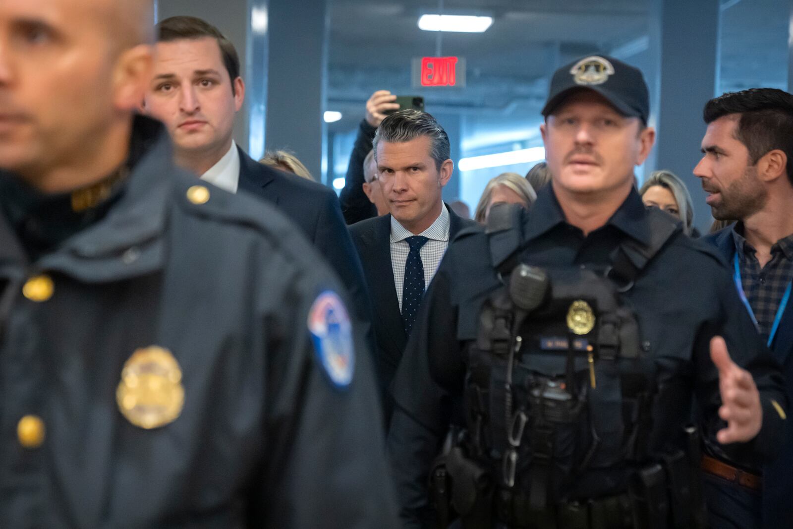 Pete Hegseth, President-elect Donald Trump's nominee to be defense secretary, walks through the basement of the Capitol, Wednesday, Dec. 4, 2024, in Washington. (AP Photo/Mark Schiefelbein)