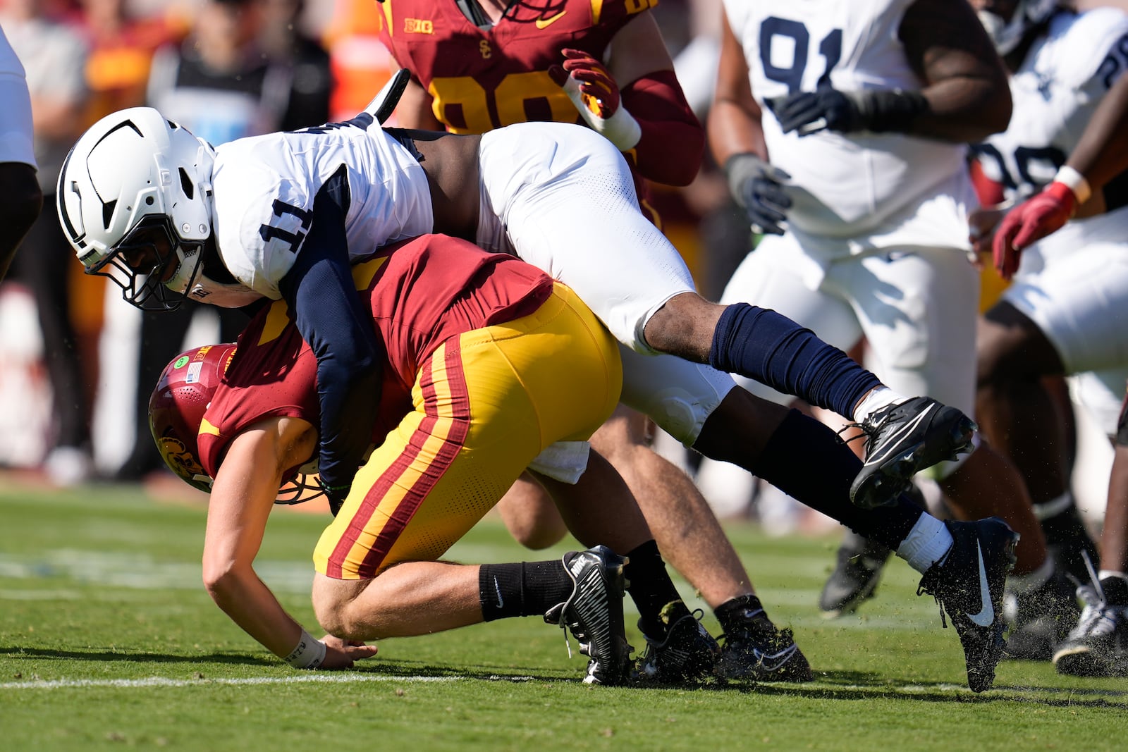 Penn State defensive end Abdul Carter (11) sacks Southern California quarterback Miller Moss during the second half of an NCAA college football game Saturday, Oct. 12, 2024, in Los Angeles. (AP Photo/Marcio Jose Sanchez)