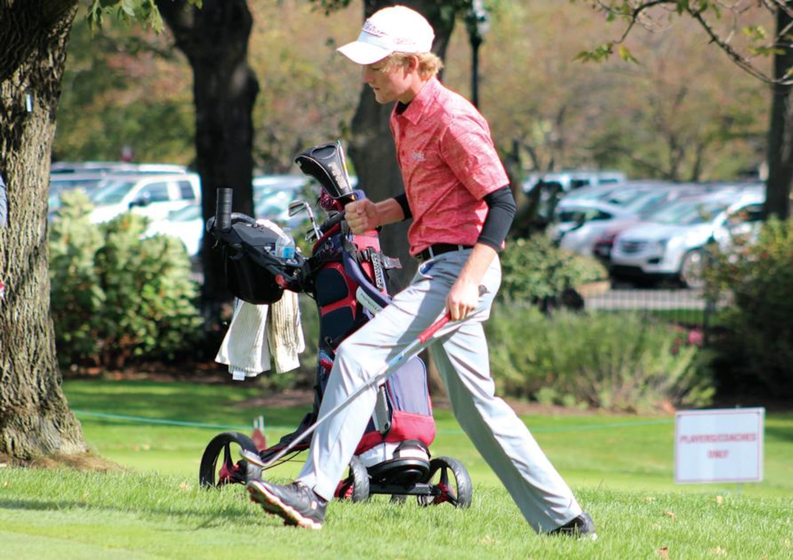 Carroll’s Tyler Goecke pumps his fist after chipping in for birdie on No. 9 Saturday in the Division I boys state golf tournament. Jeff Gilbert/CONTRIBUTED