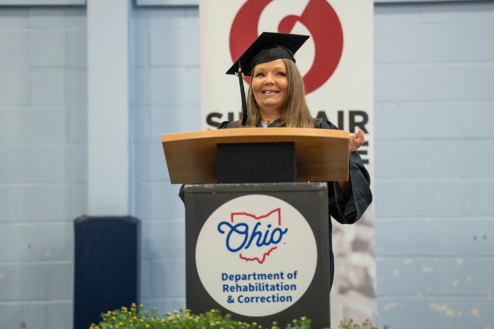 Danielle Carr, a 2024 graduate of Sinclair Community College, speaks during a graduation ceremony at the Dayton Correctional Institute on Oct. 1. Courtesy of Sinclair Community College.