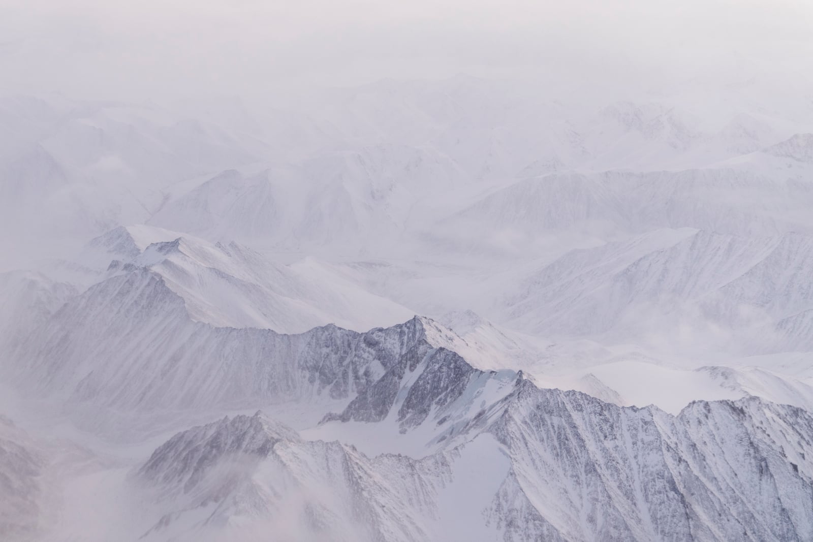 Snow covers the mountains of the Brooks Range in the Arctic National Wildlife Refuge, Monday, Oct. 14, 2024, near Kaktovik, Alaska. (AP Photo/Lindsey Wasson)