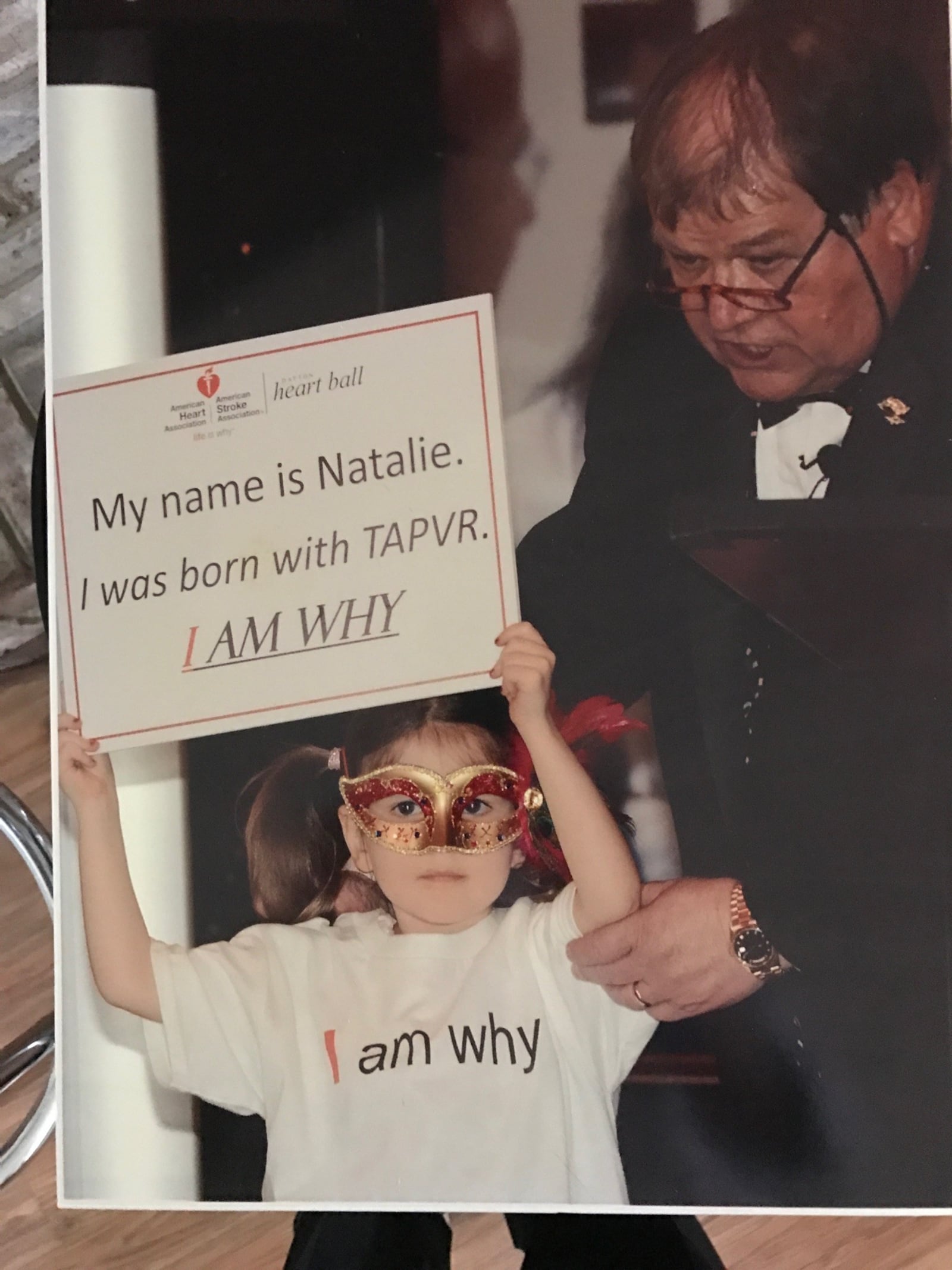 Doug Sorrell calls this one of his most prized photos. In the spring of 2015 he was the auctioneer at an American Heart event at Sinclair’s Great Hall.  He’s pictured with one of the recipients of his charity efforts, a little girl who holds the sign reading: “My name is Natalie. I was born with TAPVR. I am Why!” TAPVR is Total Anomalous Pulmonary Venous Return, a birth defect where the pulmonary veins do not properly connect to the heart. CONTRIBUTED