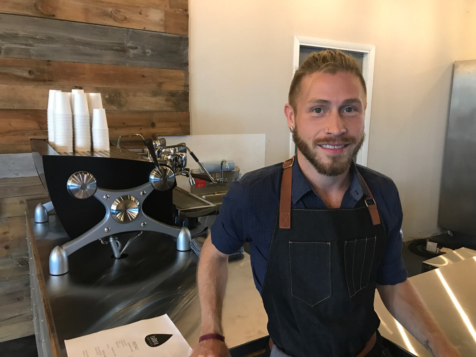 Nathan Wirrig, business owner and barista at La Gota, opened the new coffee shop today at 804 E. Monument Ave. in downtown Dayton.