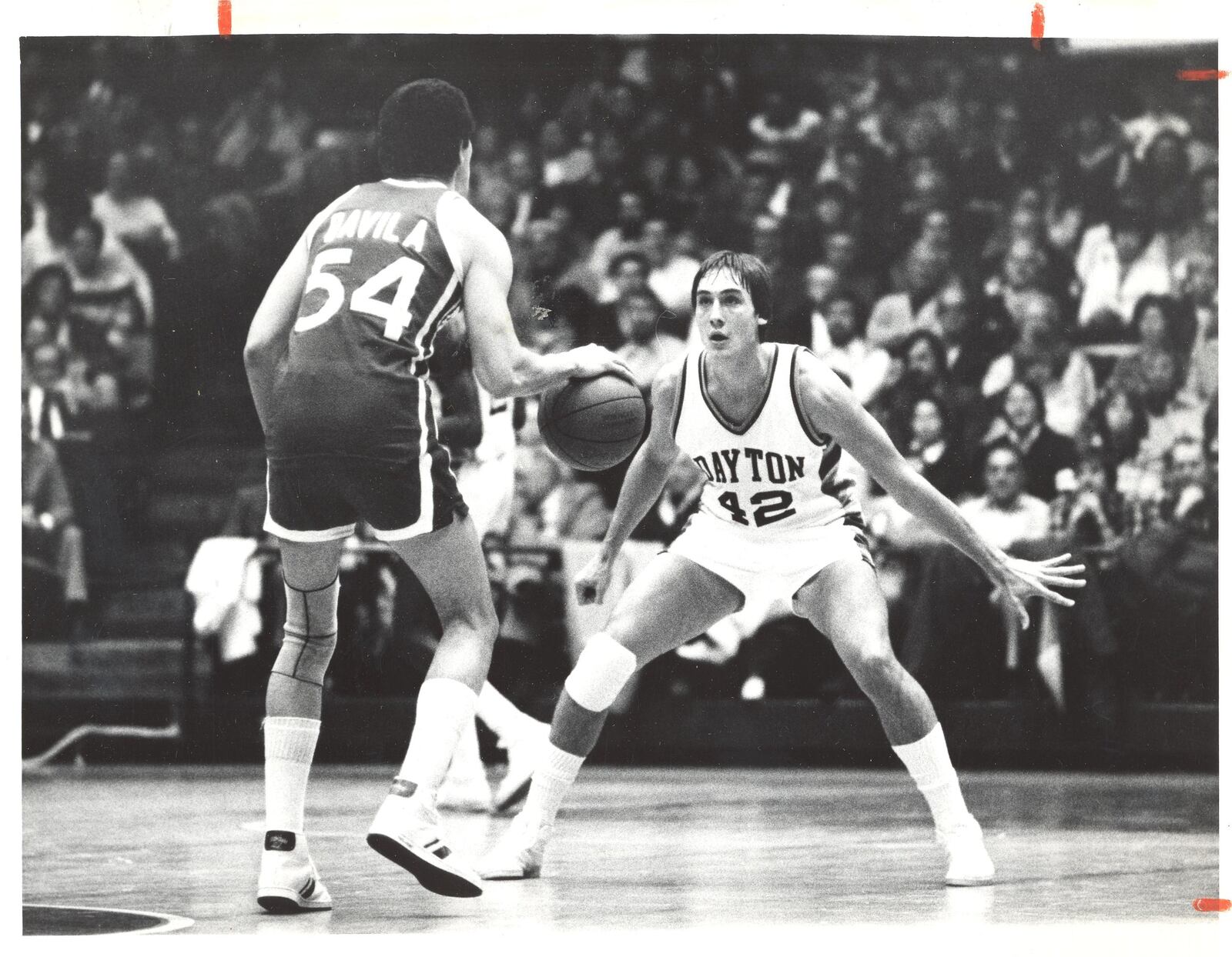 Kettering native Jim Paxson, a legendary player for the Flyers, defends against the Duquense advance. Paxson was a three-time team MVP and earned All-America honors as a senior after averaging more than 23 points per game. He went on to a distinguished career in the NBA. SOURCE: DAYTON HISTORY / LIBRARIES.WRIGHT.EDU / DAYTON DAILY NEWS / UDPRIDE.COM