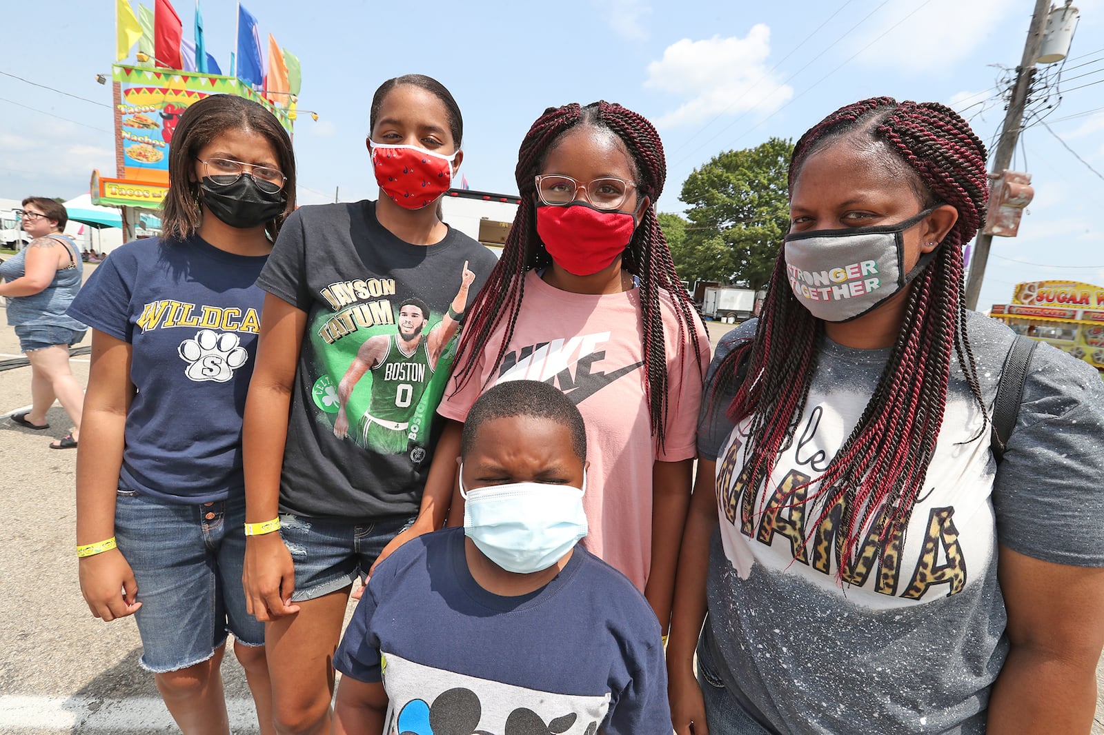 The Benton and Dearmond families were wearing their COVID masks at the Clark County Fair Wednesday. BILL LACKEY/STAFF