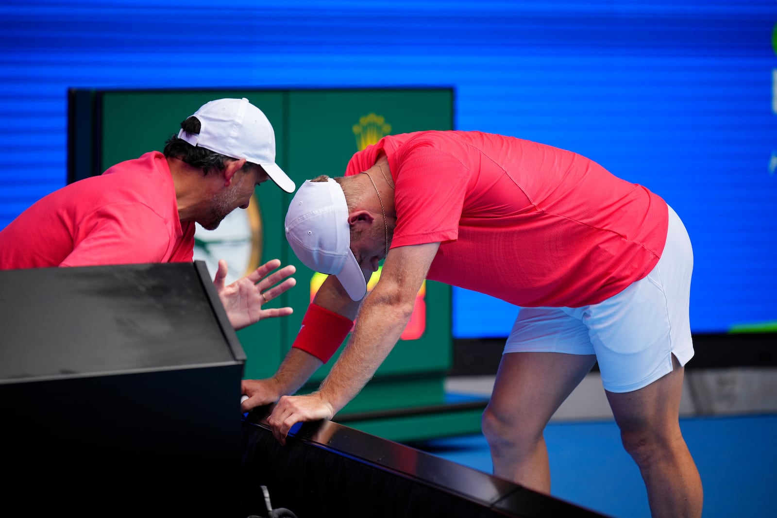 Alejandro Davidovich Fokina of Spain listens to his coach during a fourth round match against Tommy Paul of the U.S. at the Australian Open tennis championship in Melbourne, Australia, Sunday, Jan. 19, 2025. (AP Photo/Vincent Thian)