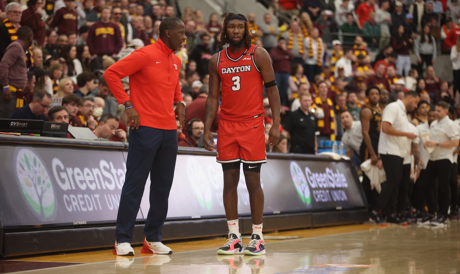 Dayton's Anthony Grant talks to Jaiun Simon in the second half against Loyola Chicago on Friday, Feb. 21, 2025, at Gentile Arena in Chicago. David Jablonski/Staff