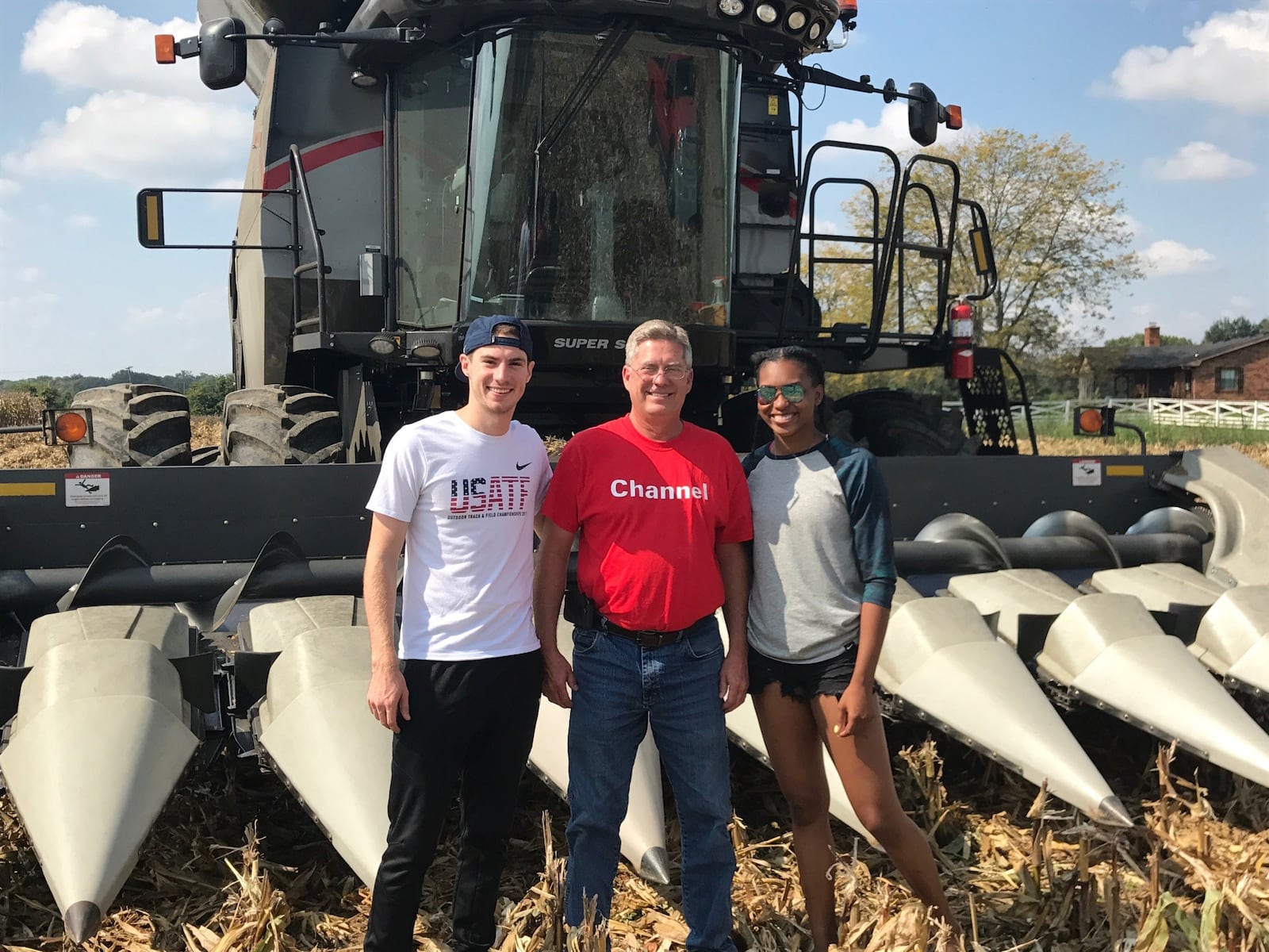 On a trip back to his rural roots, Olympian Clayton Murphy and his wife Ariana Washington visit Piqua farmer Doug DeWeese. Murphy, a Tri-Village High grad who was raised on a farm outside of New Madison and won a bronze medal in the 800 meters at the 2016 Rio de Janeiro Olympics, finished ninth in the 800 meter final Wednesday at the Tokyo Games. The Los Angeles-raised Washington was part of the USA’s 4 x 100 relay team at the 2016 Rio de Janeiro Olympics and won gold at the 2017 World Championships in London as part of the 4 x 100 meter relay team. Contributed photo