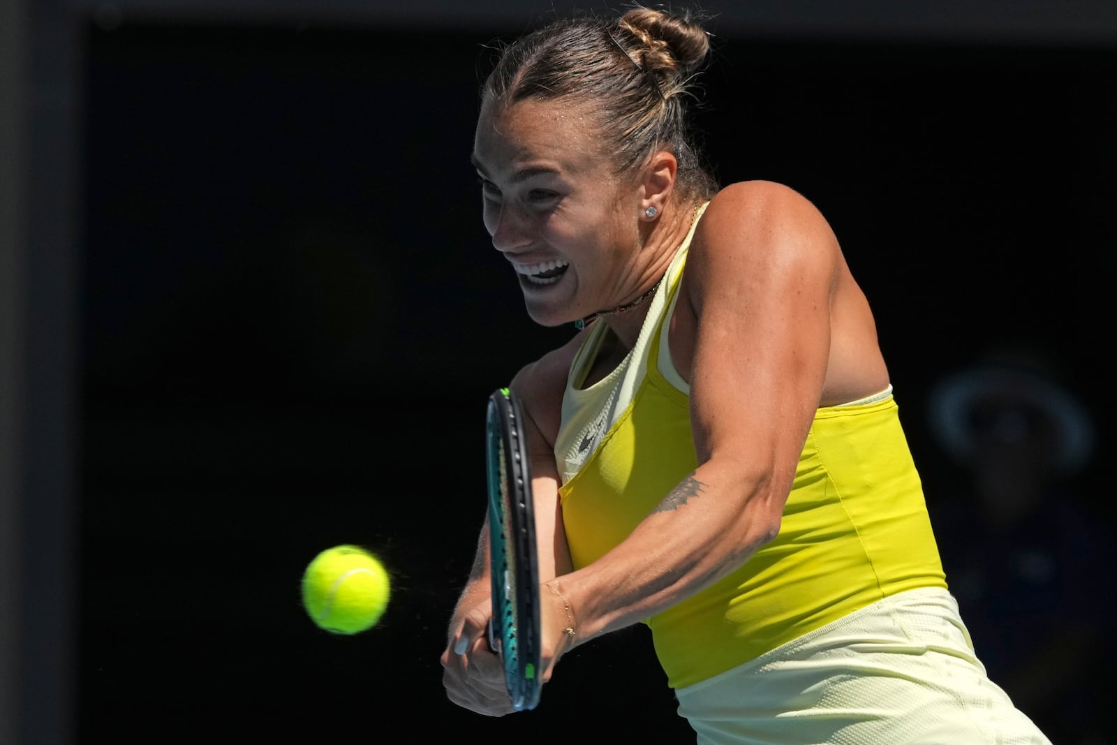 Aryna Sabalenka of Belarus returns a shot from Mirra Andreeva of Russia during their fourth round match at the Australian Open tennis championship in Melbourne, Australia, Sunday, Jan. 19, 2025. (AP Photo/Mark Baker)