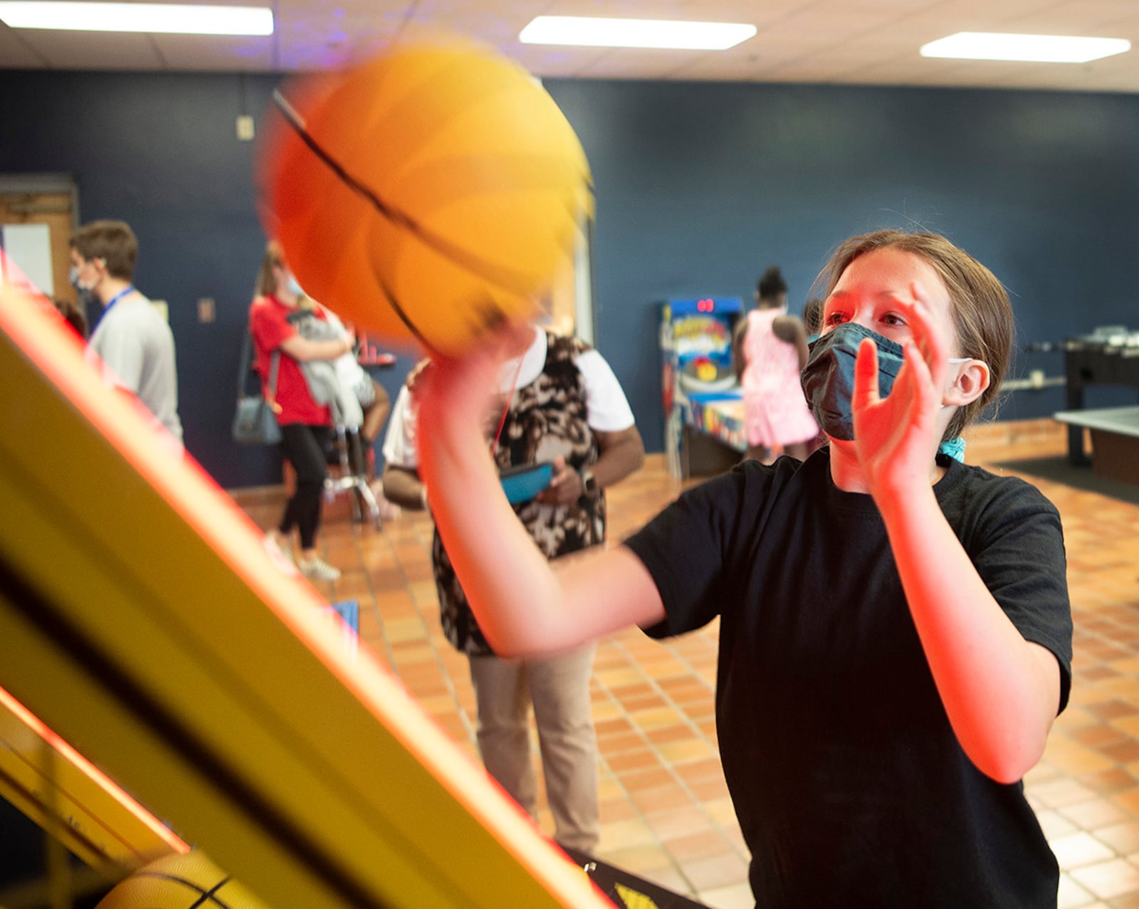 Evelyn Wilbern, 12, tries to beat the clock as she shoots baskets in the new Prairies Youth Center game room at Wright-Patterson Air Force Base on June 10. U.S. AIR FORCE PHOTO/R.J. ORIEZ