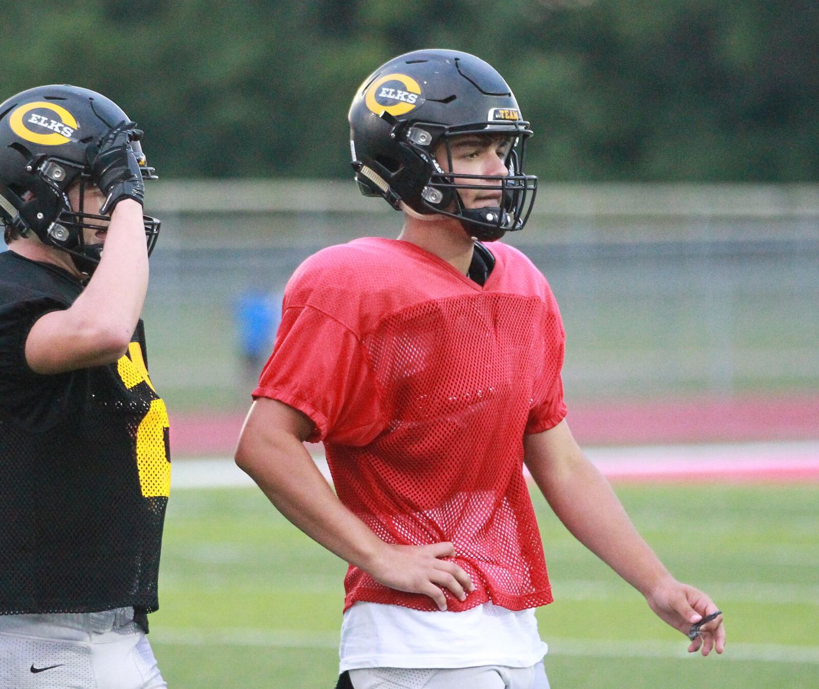 Centerville High School sophomore QB Chase Harrison leads the Elks at Trotwood-Madison in a football preseason scrimmage on Thursday, Aug. 22, 2019. MARC PENDLETON / STAFF