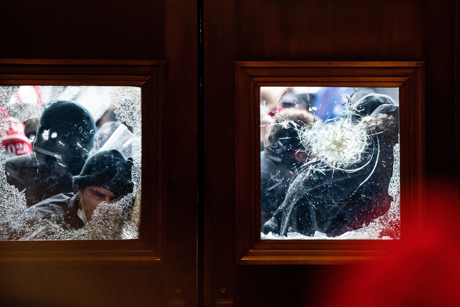 Pro-Trump protesters storm the Capitol in Washington, Wednesday, Jan. 6, 2021, on the same day as a joint session of Congress met to certify the electoral votes from the 2020 presidential election. President Trump’s efforts to overturn the 2020 presidential election came to a dangerous head on Wednesday when a mob of his supporters stormed the Capitol following a rally in which Trump once again falsely claimed widespread voter fraud. (Erin Schaff/The New York Times)