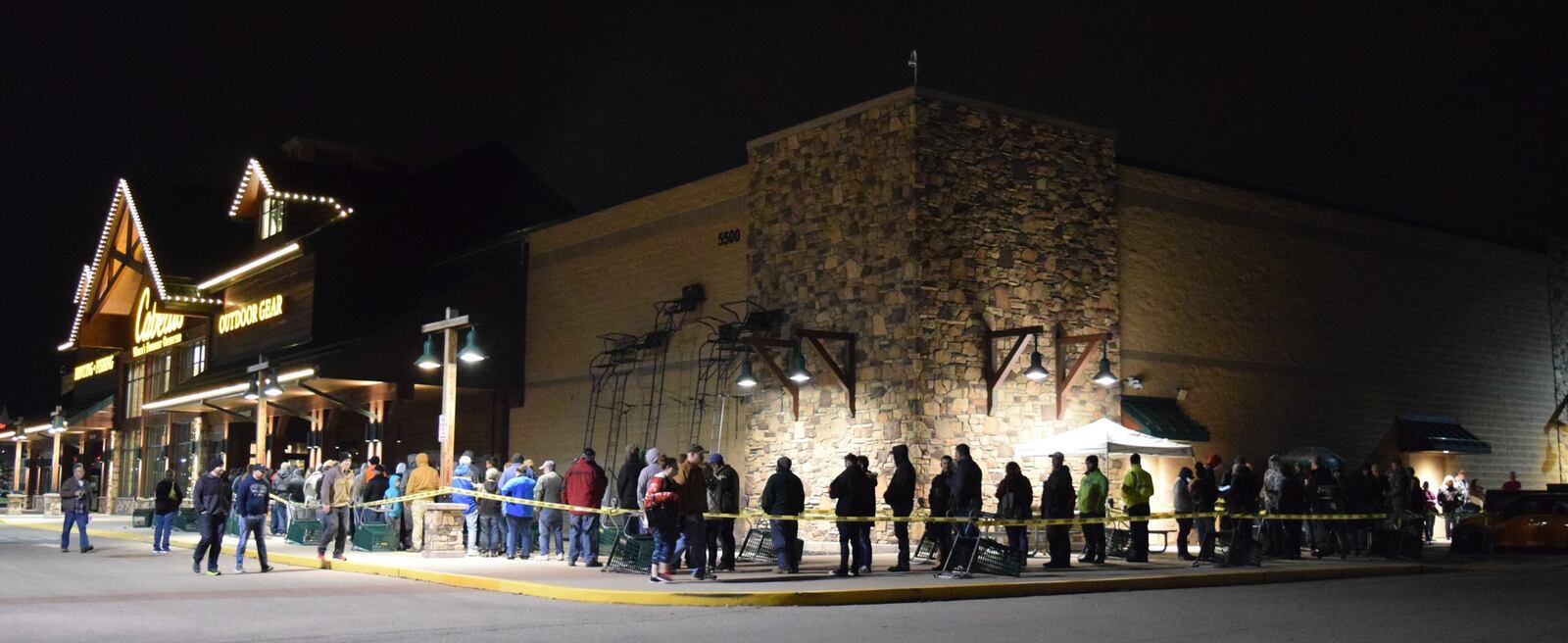 Hundreds of people lined up outside Cabela’s early Friday when doors opened at 5 a.m. The retailer had deals on clothes, guns and other fishing and hunting gifts. STAFF PHOTO / HOLLY SHIVELY