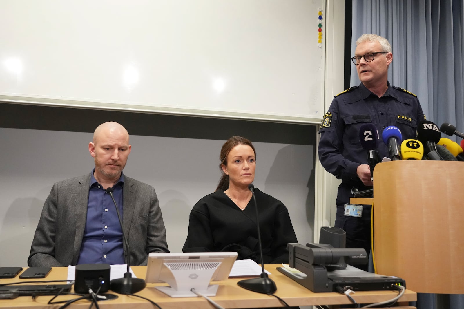 Police Area Commander Lars Wiren, right, Police chief investigator Anna Bergkvist, centre, and Police chief investigators Kristoffer Zickbauer attend a news conference after a shooting at an adult education center, in Orebro, Sweden, Thursday, Feb. 6, 2025. (AP Photo/Sergei Grits)