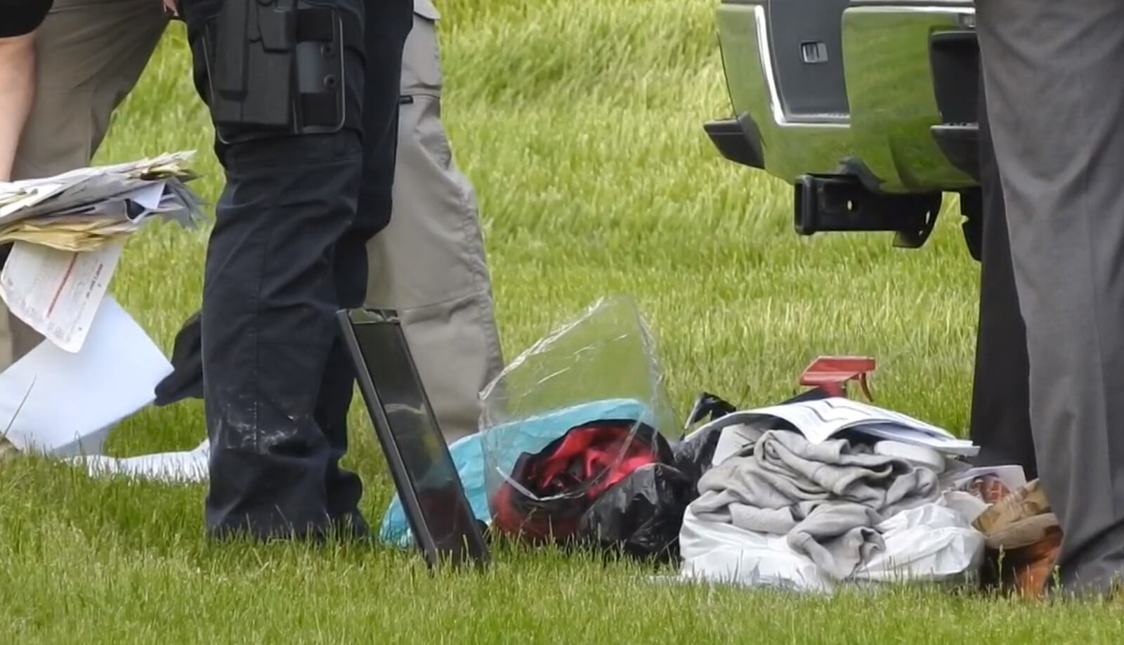 Police search a vehicle in the Beckett Meadows Condominium community on Friday afternoon, May 3, in relation to the quadruple homicide on April 28. NICK GRAHAM/STAFF