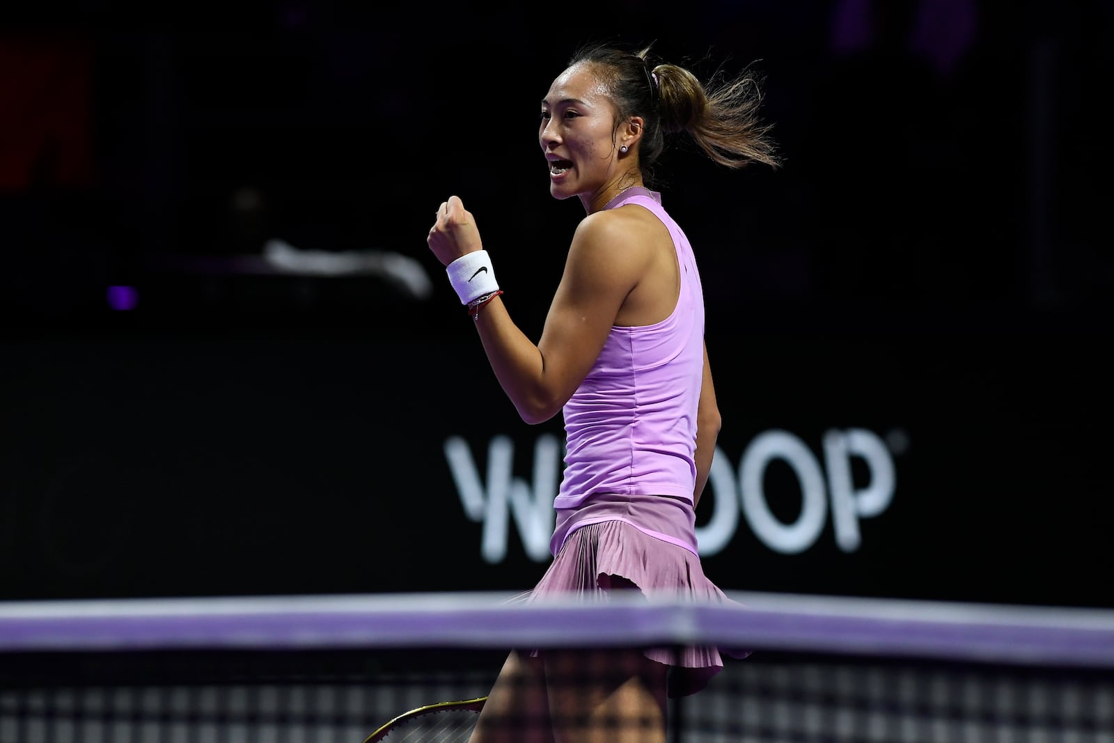 China's Qinwen Zheng reacts after winning a point against Coco Gauff of the U.S. during their women's singles final match of the WTA finals at the King Saud University Indoor Arena, in Riyadh, Saudi Arabia, Saturday, Nov. 9, 2024. (AP Photo)