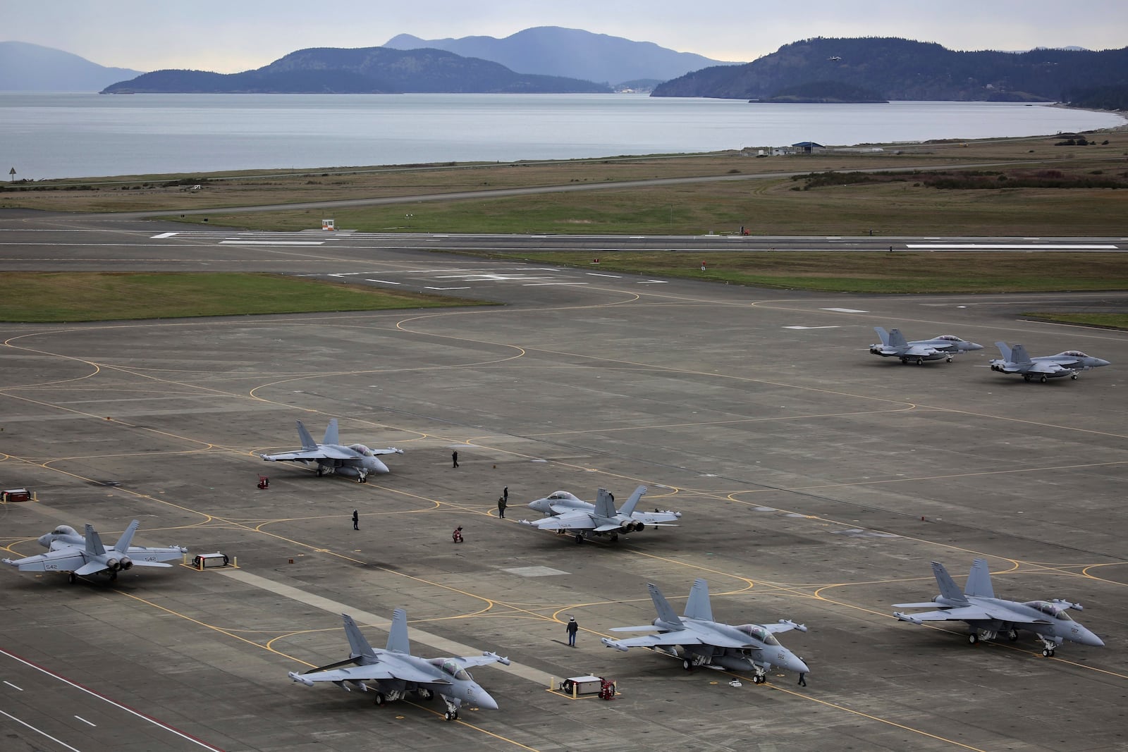 EA-18G Growlers, with some of San Juan Islands in the background, prepare for an exercise at Naval Air Station Whidbey Island, March 10, 2016. (Ken Lambert/The Seattle Times via AP)