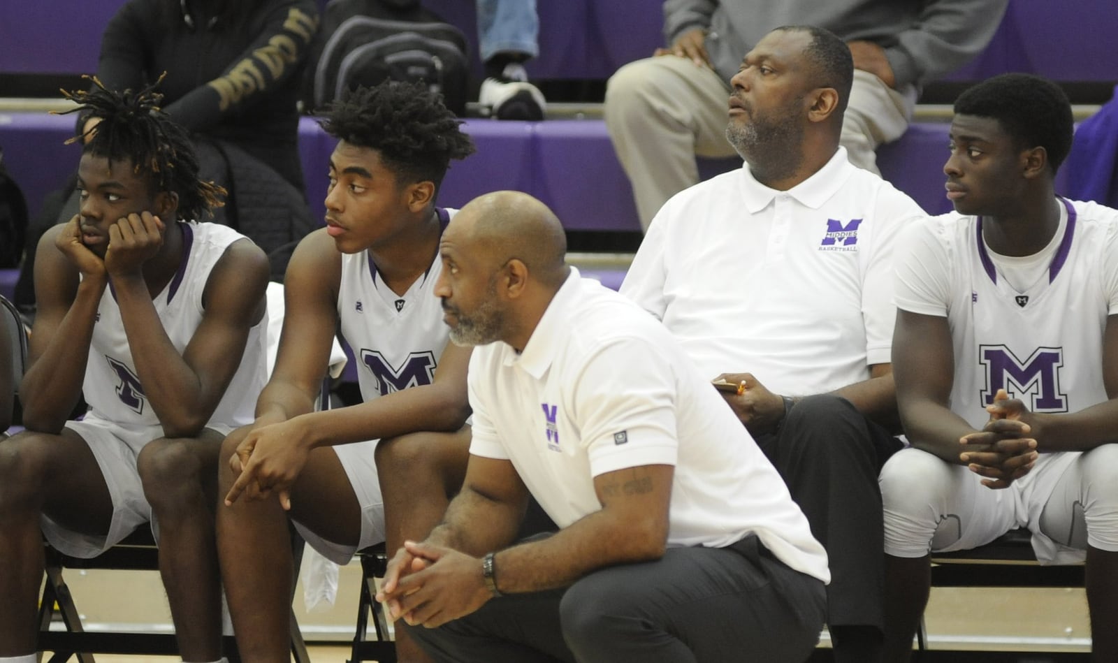 Former Ponitz head coach Steve Pittman (second from right) is in his first season as a Middies assistant to head coach Darnell Hoskins (front). Middletown defeated visiting Dunbar 60-28 in a boys high school basketball game on Tuesday, Dec. 4, 2018. MARC PENDLETON / STAFF