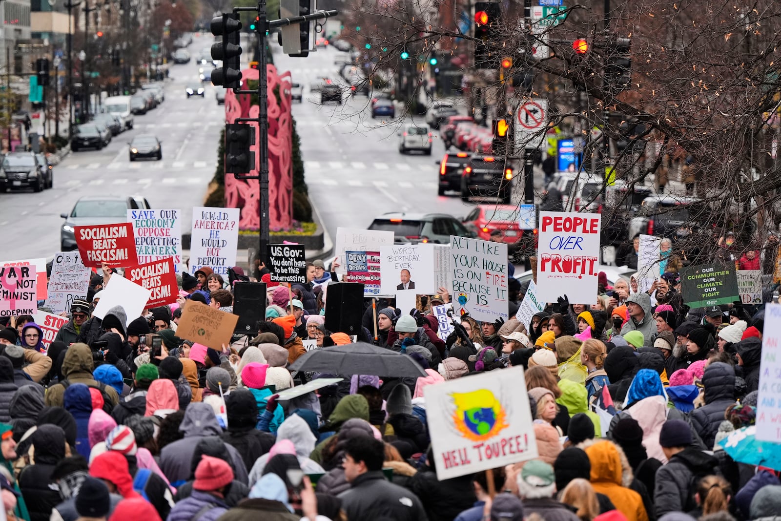 A group gathers in Farragut Square before the start of the People's March, Saturday, Jan. 18, 2025, in Washington. (AP Photo/Mike Stewart)