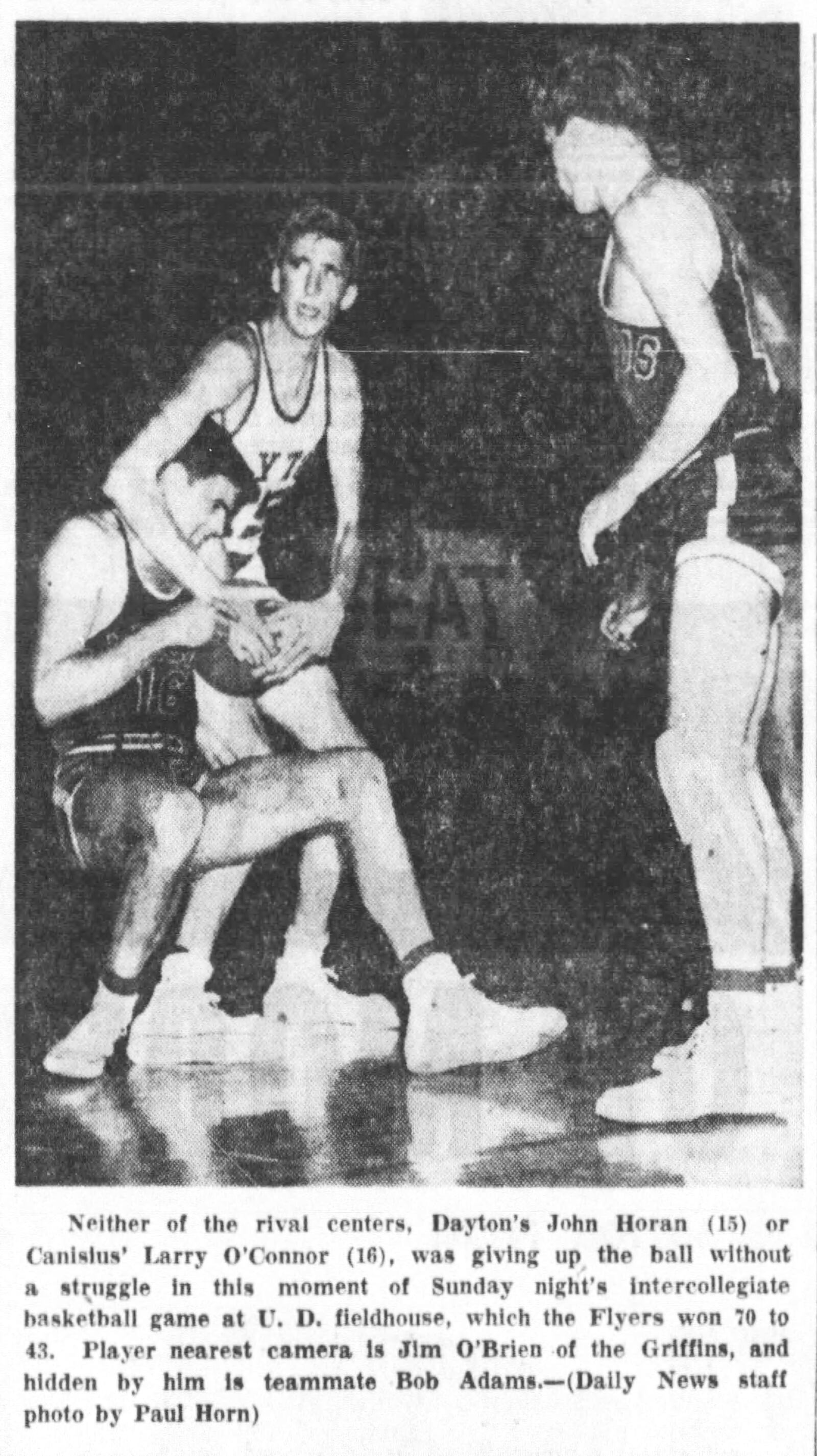 Dayton Flyer John Horan fights for the ball during a game against Canisius in 1953. DAYTON DAILY NEWS ARCHIVES