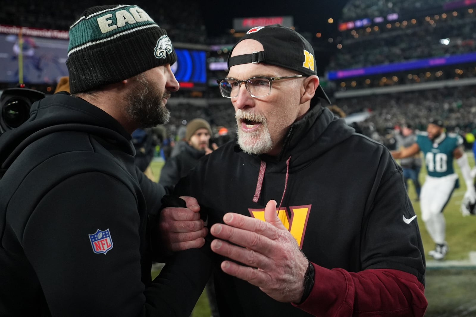 Philadelphia Eagles coach Nick Sirianni, left, shakes hands with Washington Commanders coach Dan Quinn, after the NFC Championship NFL football game, Sunday, Jan. 26, 2025, in Philadelphia. (AP Photo/Matt Slocum)