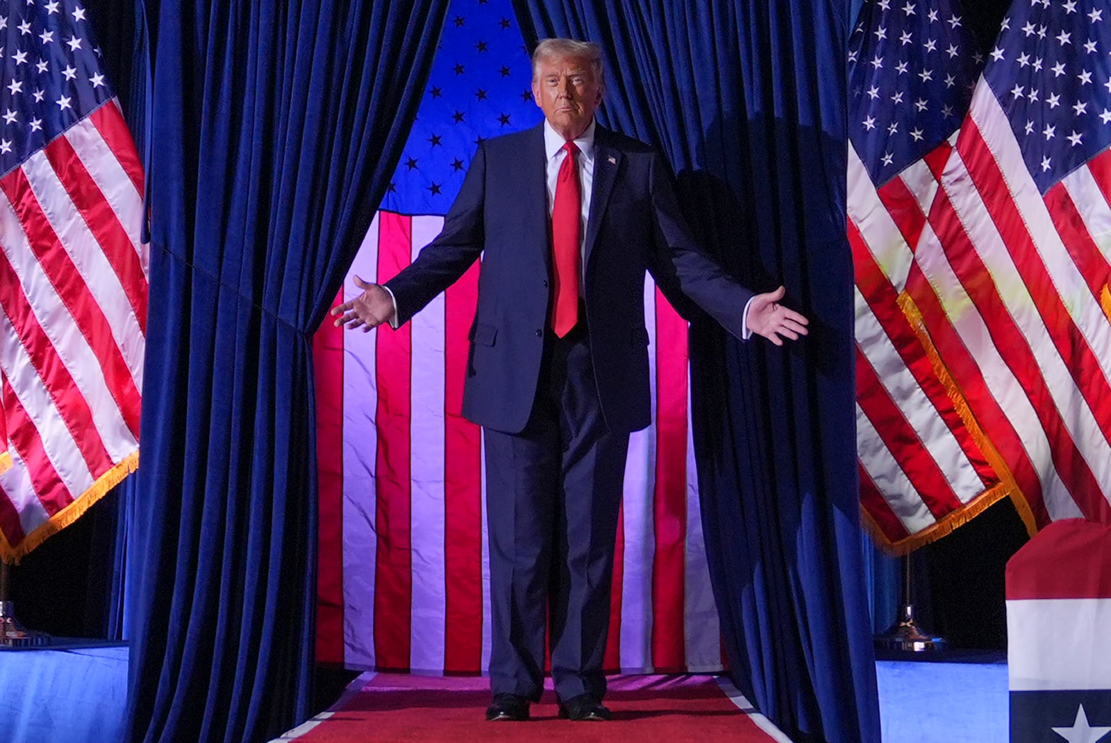 Republican presidential nominee former President Donald Trump arrives at a campaign rally at Van Andel Arena, Tuesday, Nov. 5, 2024, in Grand Rapids, Mich. (AP Photo/Evan Vucci)