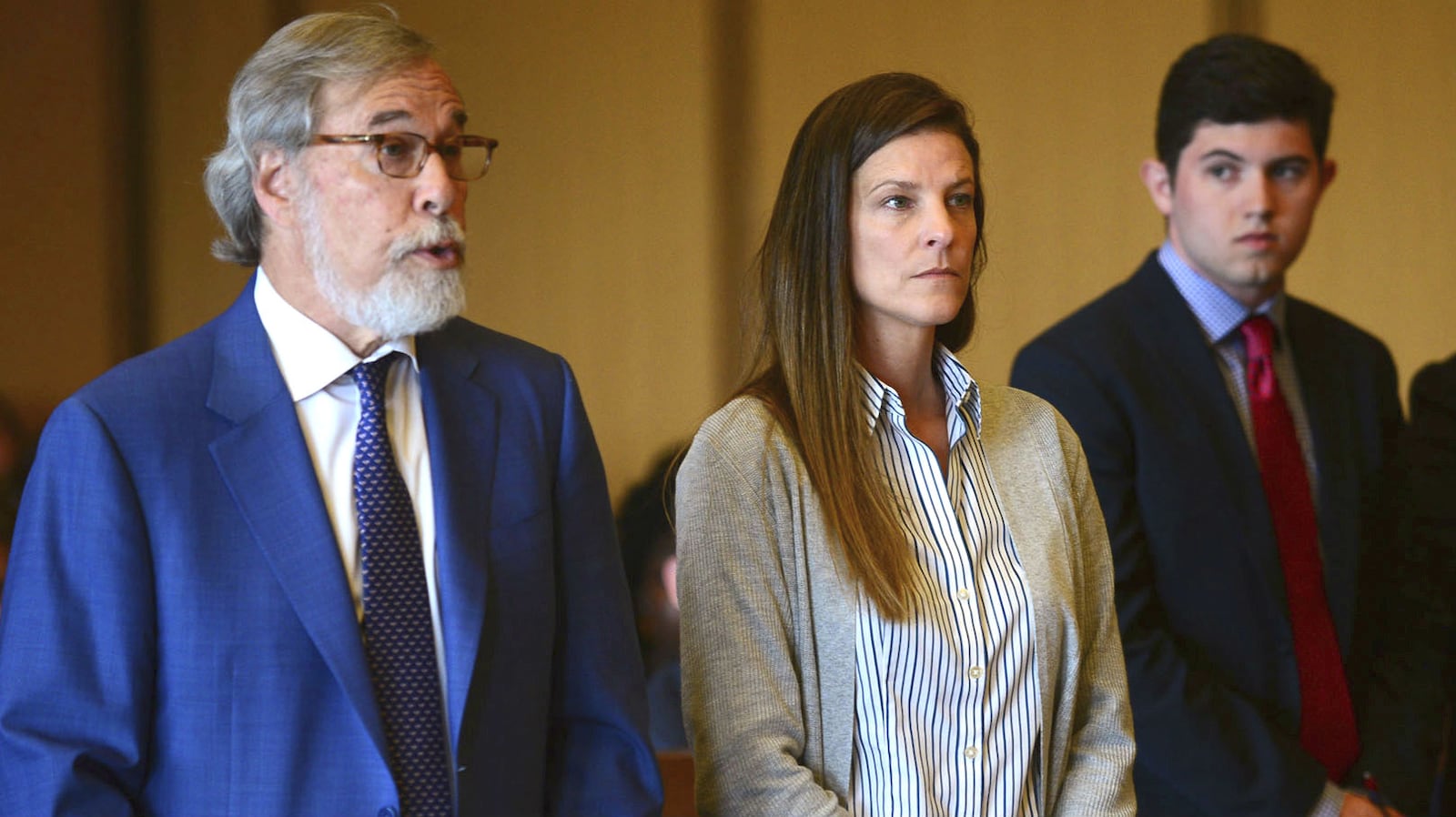 Michelle Troconis, center, listens, as her attorney, Andrew Bowman, left, addresses the court during a court hearing Tuesday, June 11, 2019, in Stamford, Conn. Fotis Dulos and Troconis, his girlfriend, have been charged with evidence tampering and hindering prosecution in the disappearance of Dulos’ wife, Jennifer Dulos. The 50-year-old mother of five has been missing since May 24, 2019.