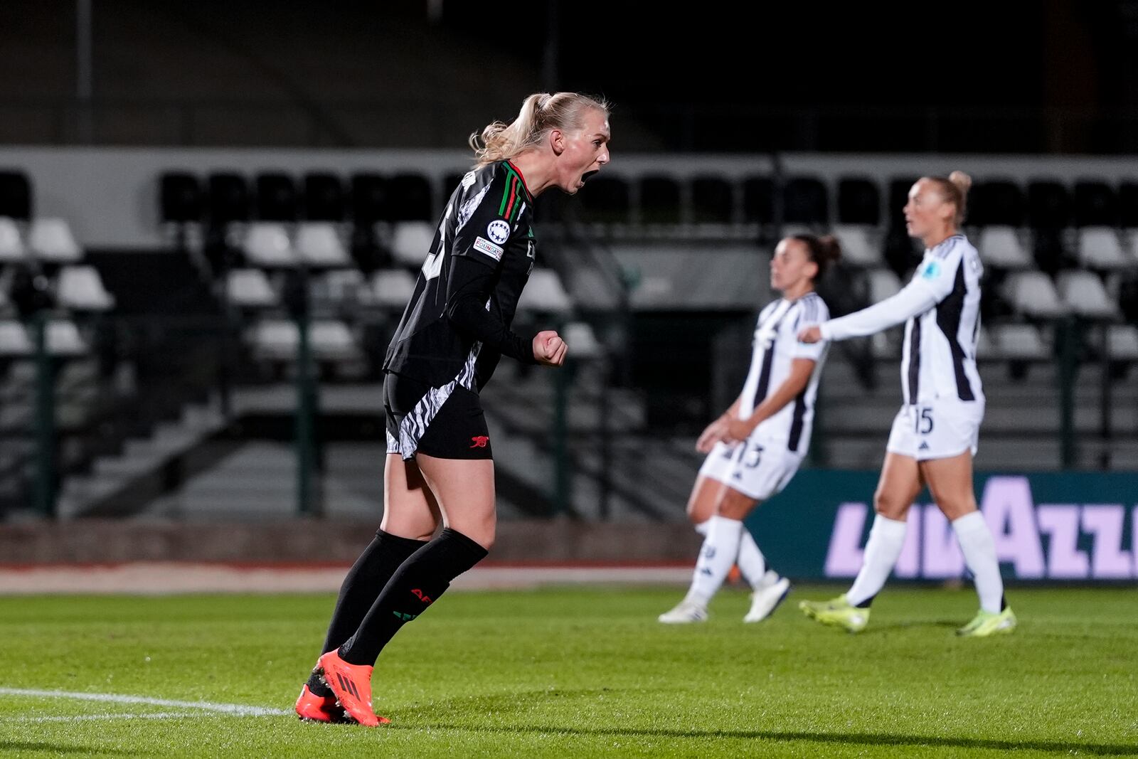 Arsenal's Stina Blackstenius scores his side's second goal during the women's Champions League soccer match between Juventus and Arsenal at the Vittorio Pozzo La Marmora Stadium in Biella, Italy, Tuesday, Nov. 12, 2024. (Fabio Ferrari/LaPresse via AP)