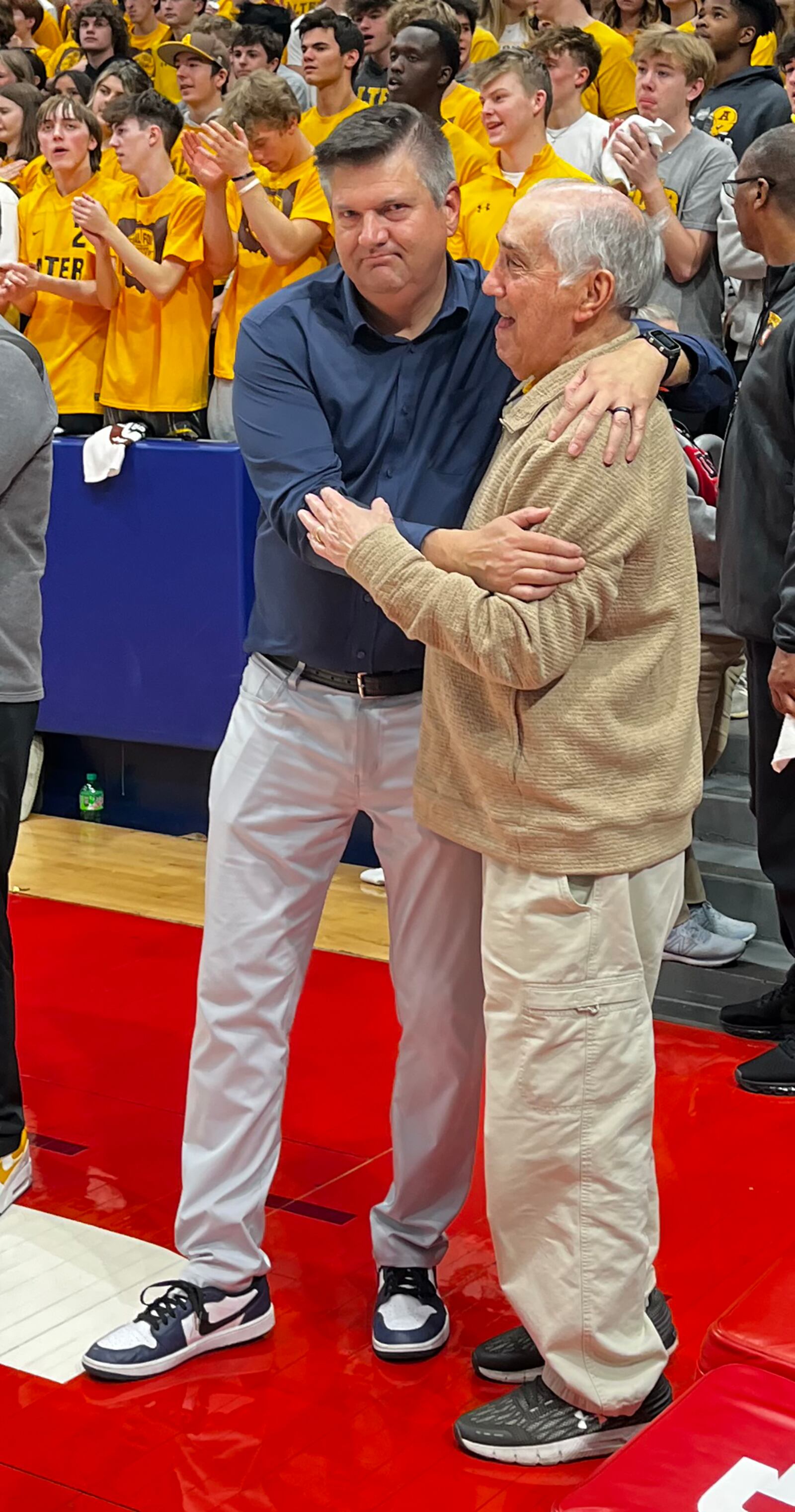 Alter head coach Eric Coulter (left) enjoyed some postgame moments with former Alter coach Joe Petrocelli after the Knights won the Division II state title Sunday at UD Arena. Jeff Gilbert/CONTRIBUTED