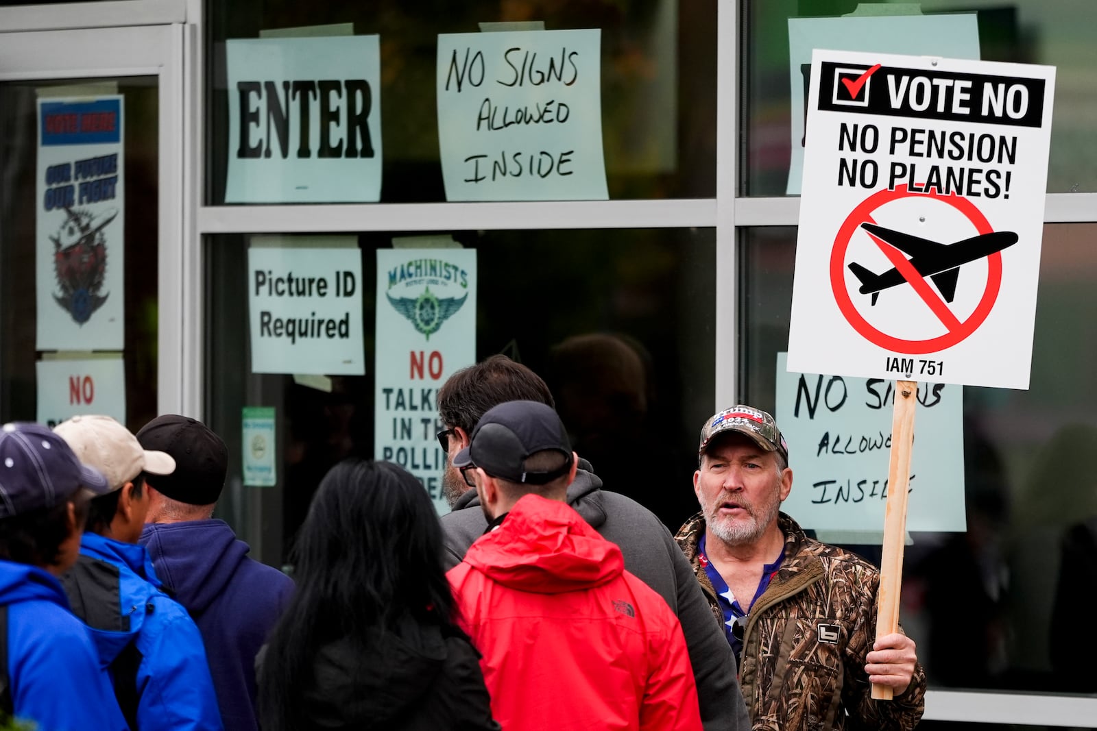 Bartley Stokes Sr., who has worked for Boeing for 46 years, encourages other employees on strike to vote no on a new contract offer from the company Wednesday, Oct. 23, 2024, at a voting location in the Angel of the Winds Arena in Everett, Wash. (AP Photo/Lindsey Wasson)