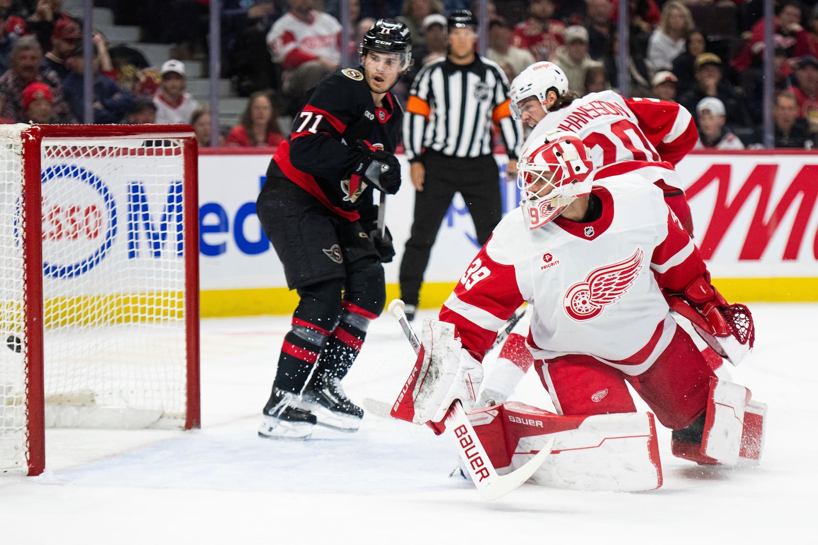 Detroit Red Wings goaltender Cam Talbot (39) watches the puck enter his net for a goal by Ottawa Senators forward David Perron (not shown) during second-period NHL hockey game action in Ottawa, Ontario, Monday, March 10, 2025. (Spencer Colby/The Canadian Press via AP)