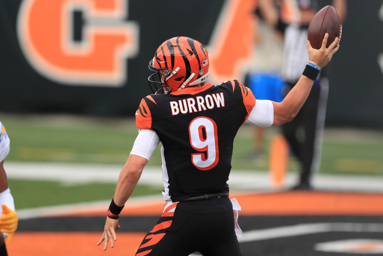 Cincinnati Bengals quarterback Joe Burrow (9) reacts after running for a touchdown during the first half of an NFL football game against the Los Angeles Chargers, Sunday, Sept. 13, 2020, in Cincinnati. (AP Photo/Aaron Doster)