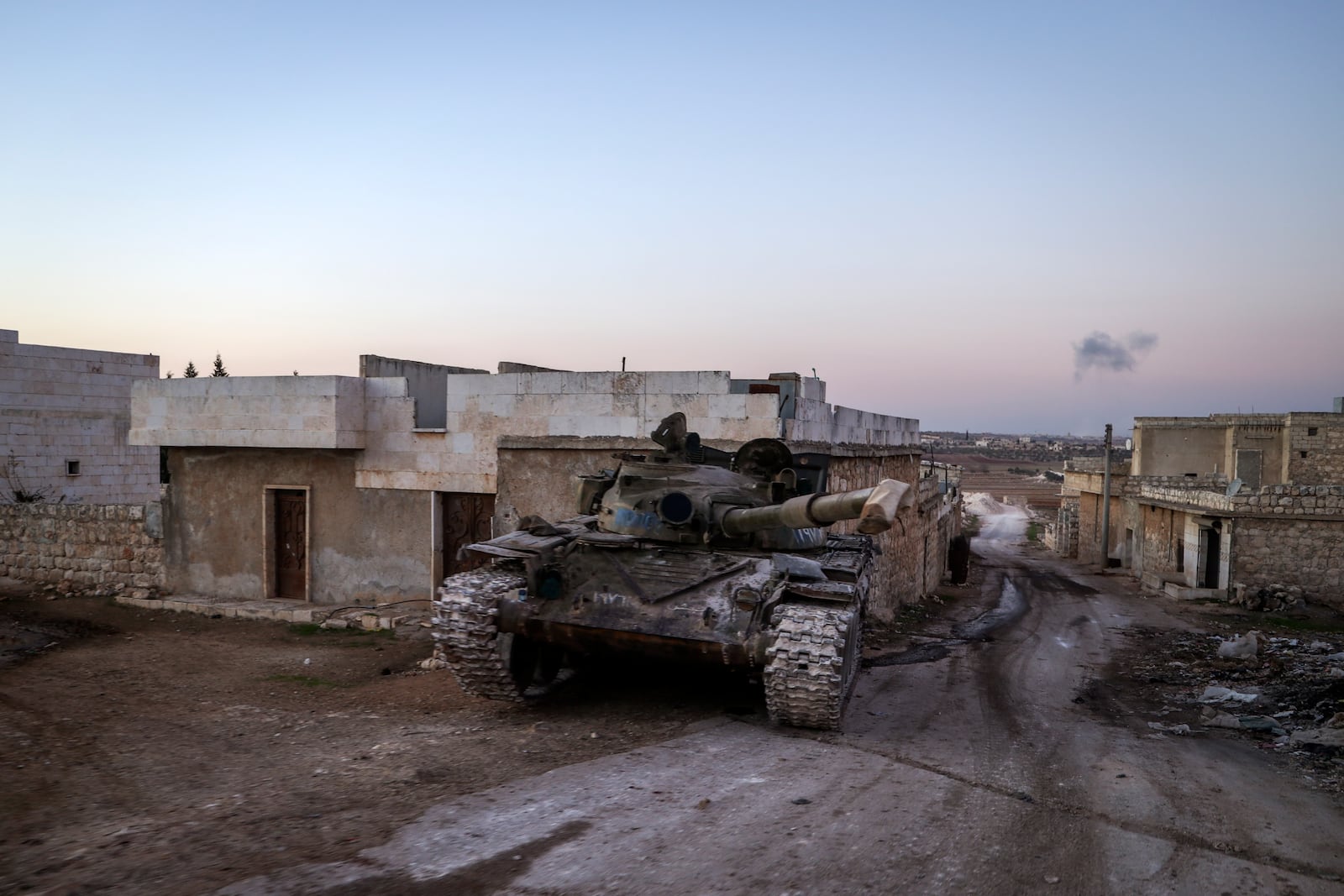 A destroyed Syrian army tank sits in the village of Anjara, western outskirts of Aleppo, Syria, Thursday Nov. 29, 2024. Syrian armed groups launched a large-scale attack on areas controlled by government forces and seized territory in northwestern Syria, opposition groups said Thursday.(AP Photo/Omar Albam)