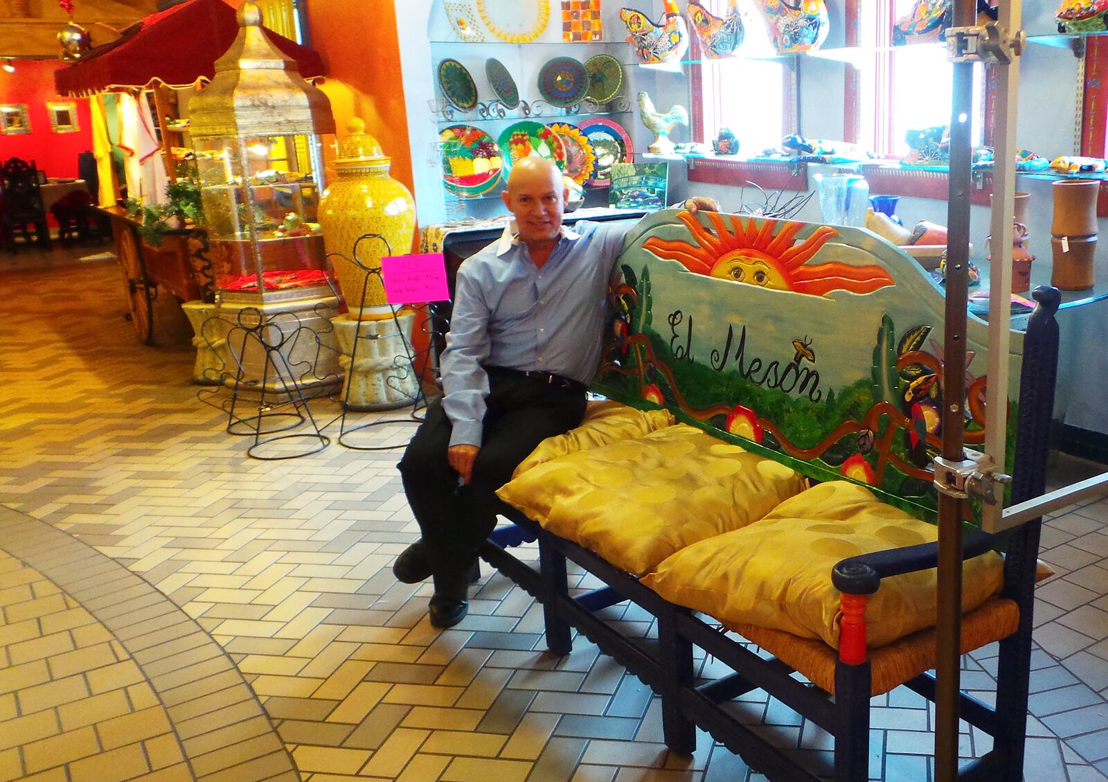 Bill Castro, co-owner of El Meson, sits in his restaurants market area where items including jewelry and pottery can be purchased. Contributed photo by Alexis Larsen