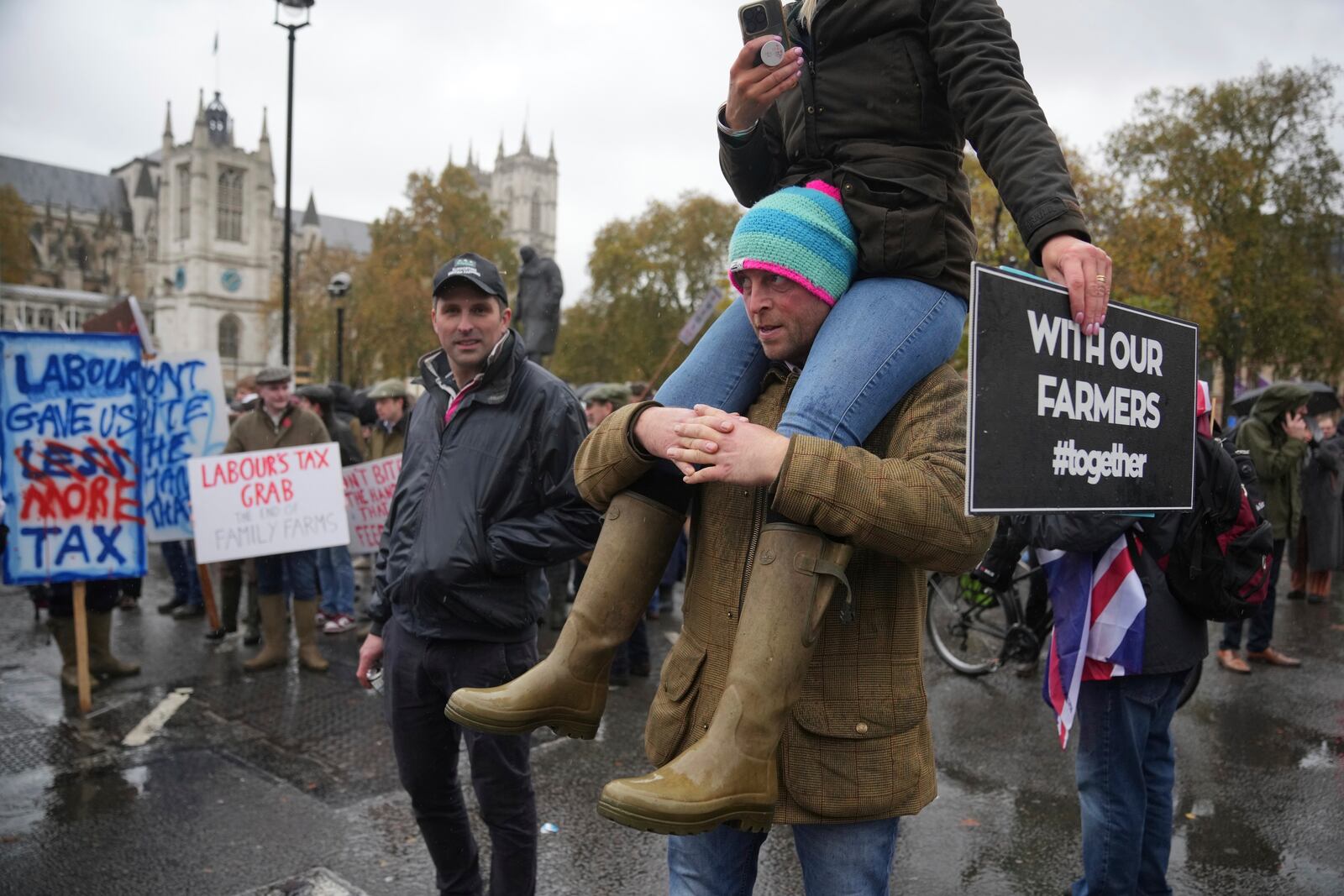 The National Farmers' Union members attend a protest against the planned changes to tax rules, in London, Tuesday, Nov. 19, 2024. (AP Photo/Kin Cheung)