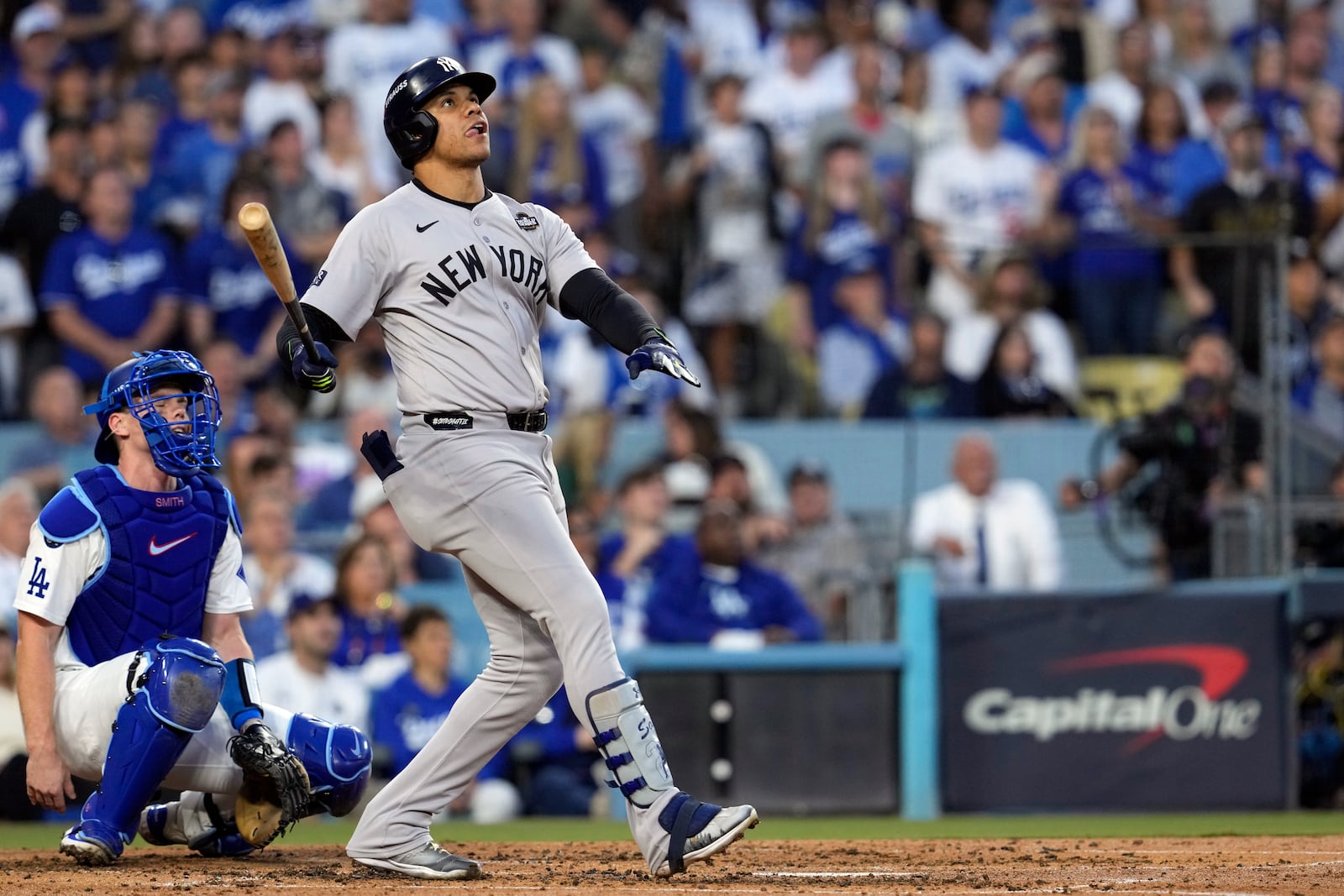 New York Yankees' Juan Soto, right, watches his home run along with Los Angeles Dodgers catcher Will Smith during the third inning in Game 2 of the baseball World Series, Saturday, Oct. 26, 2024, in Los Angeles. (AP Photo/Godofredo A. Vásquez)